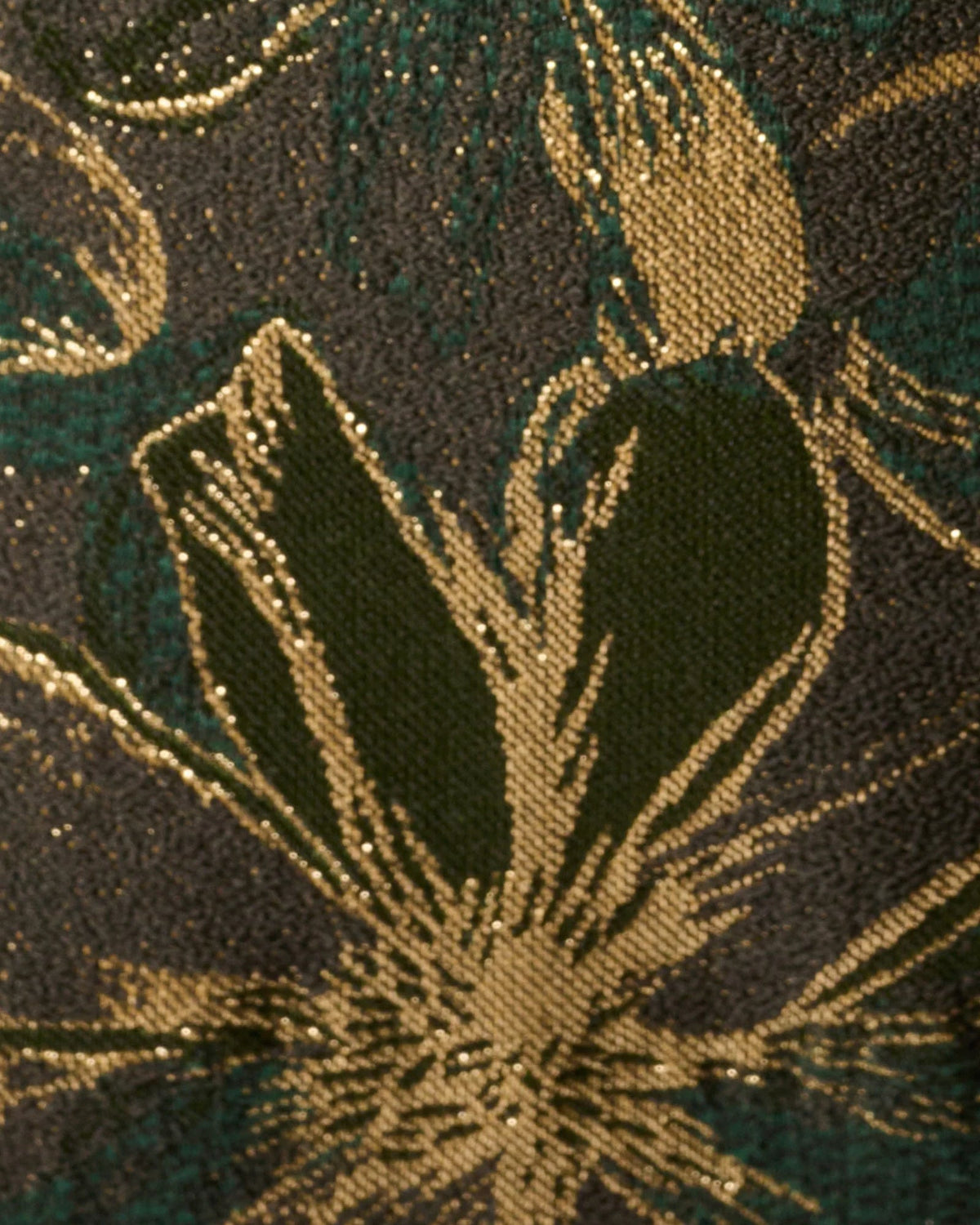 Close-up of dark olive fabric with gold floral sequin-like embroidery pattern