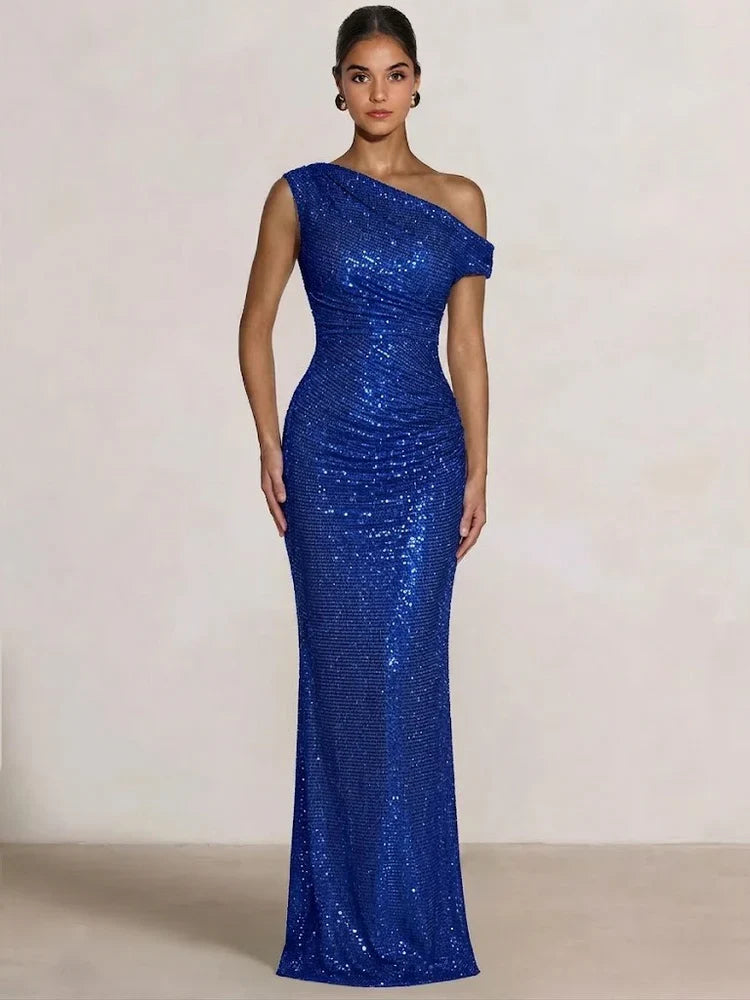 Royal blue one-shoulder sequin mermaid gown with ruching, floor length.