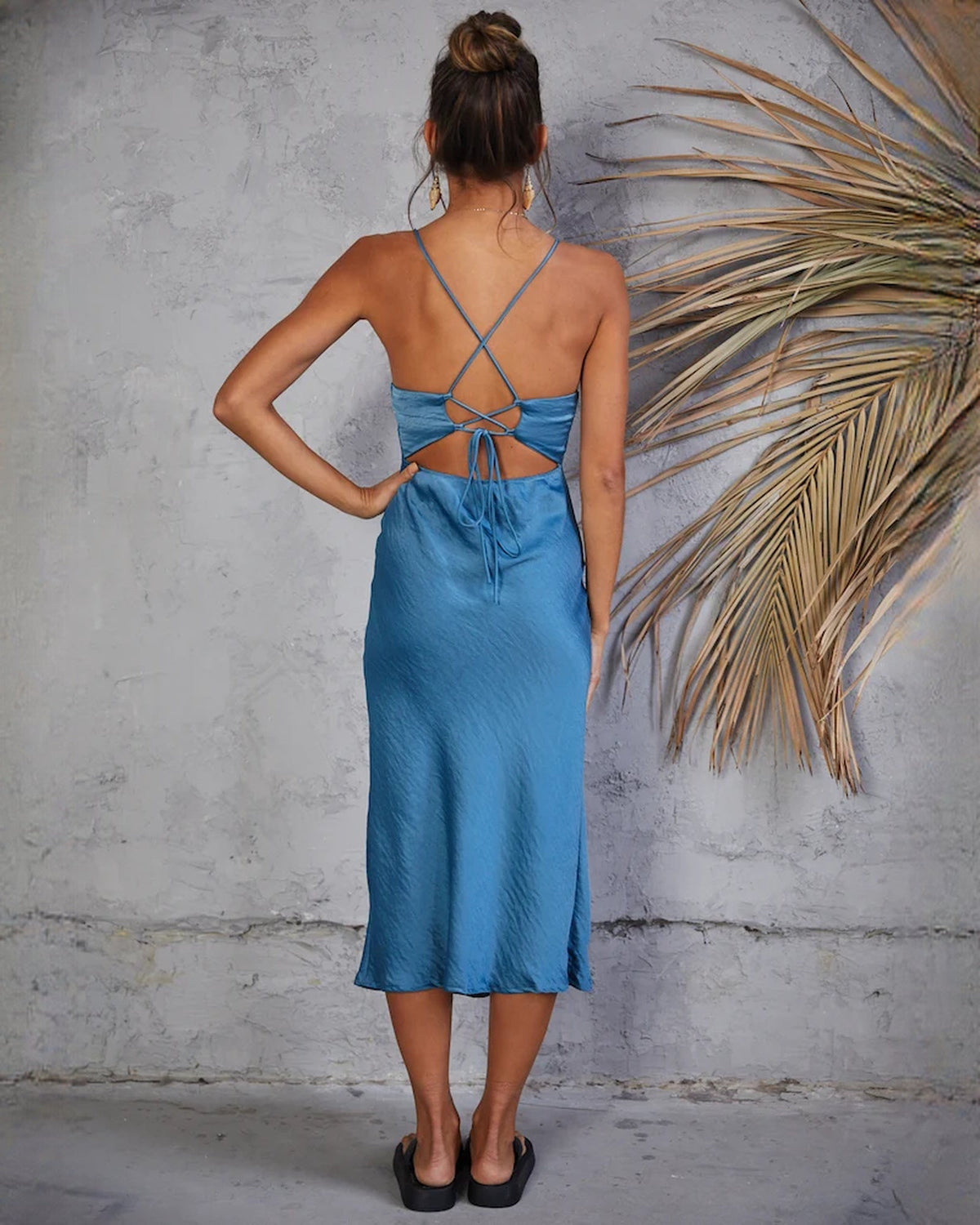 Ocean blue satin slip dress back view with crisscross tie straps