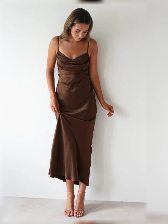 Brown satin slip mermaid dress with cowl neckline, spaghetti straps, and midi hem