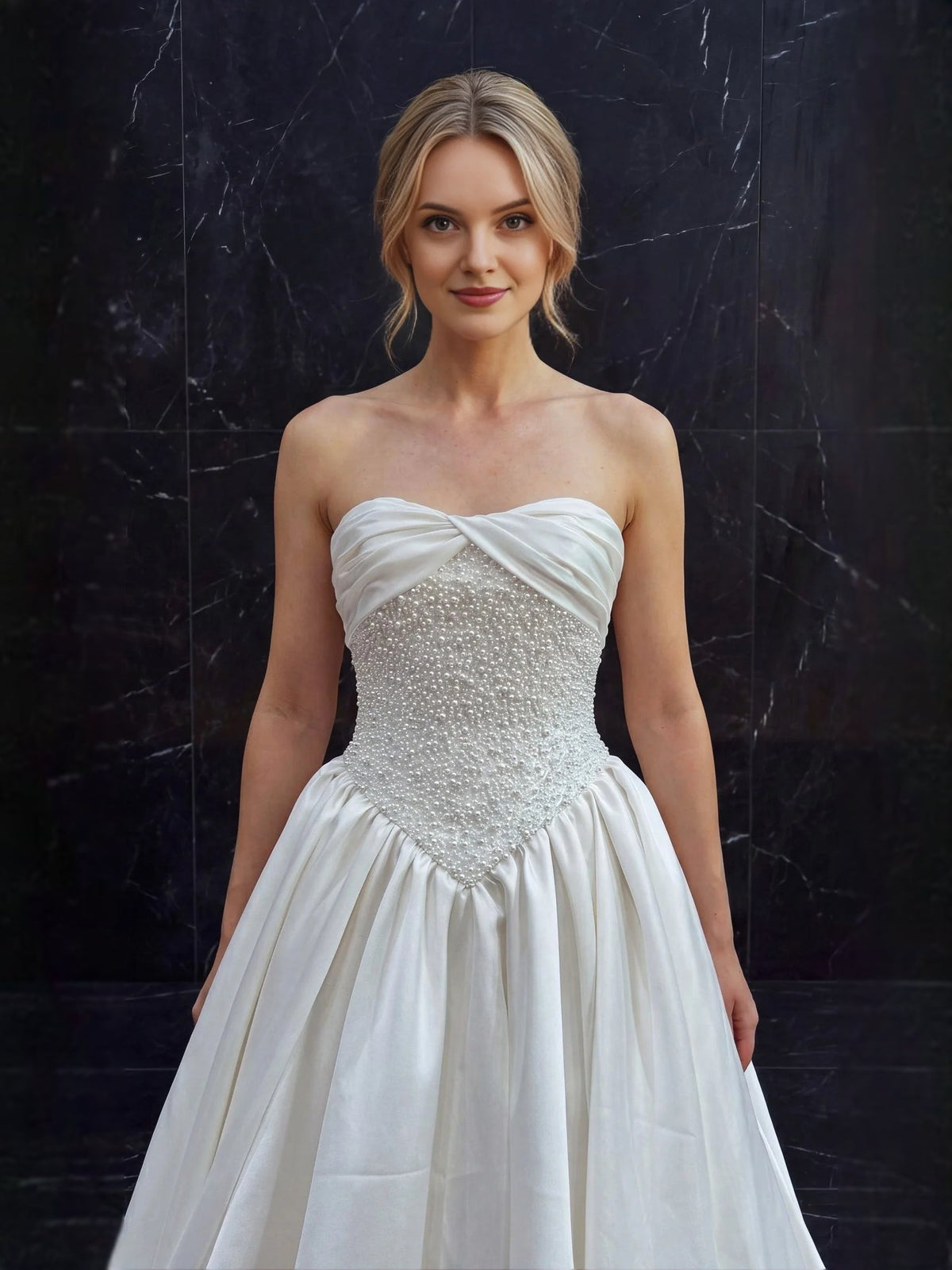 Ivory strapless A-line satin wedding dress with sweetheart drape and beaded waist