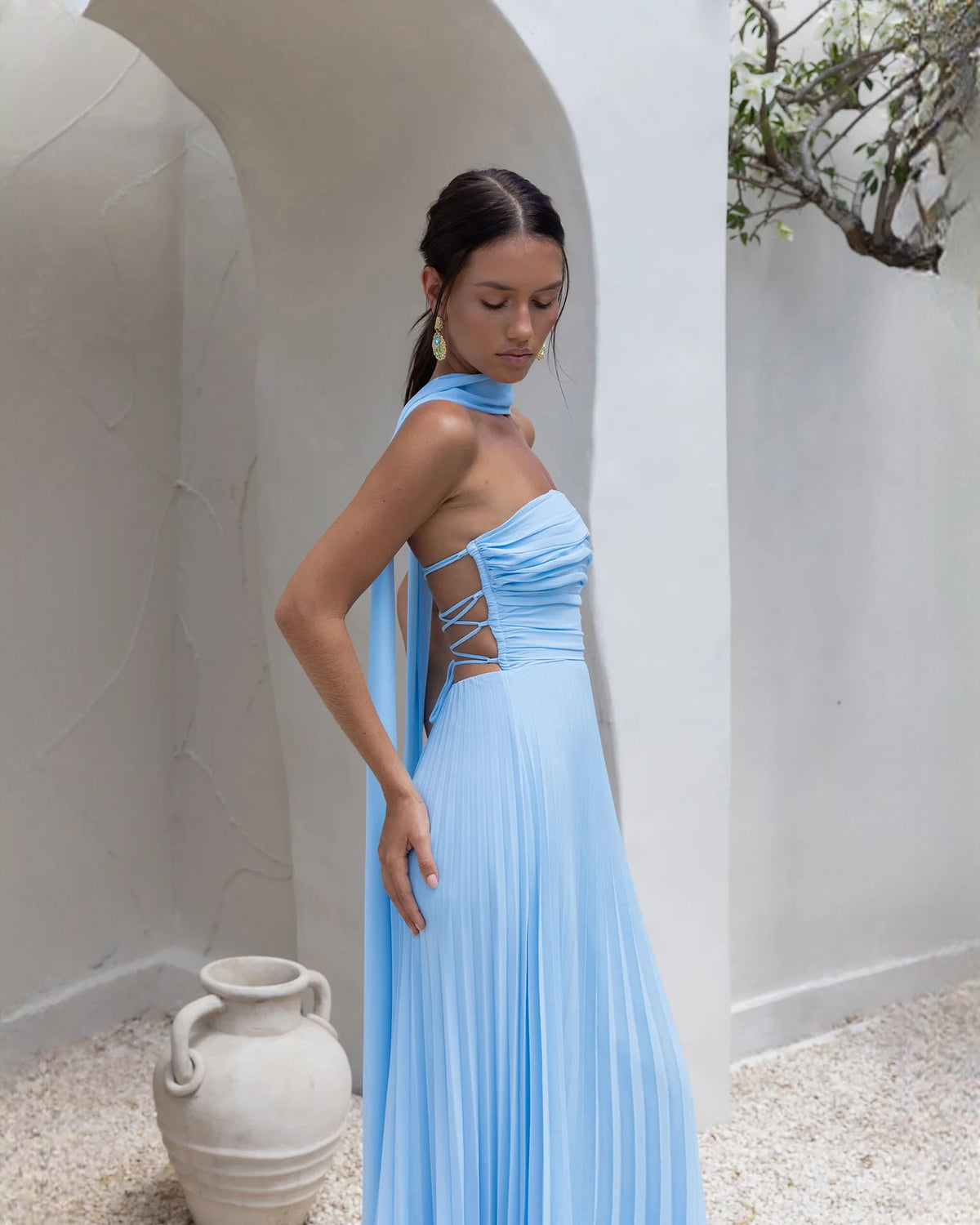 Blue strapless chiffon maxi A-line dress with crisscross open back detail