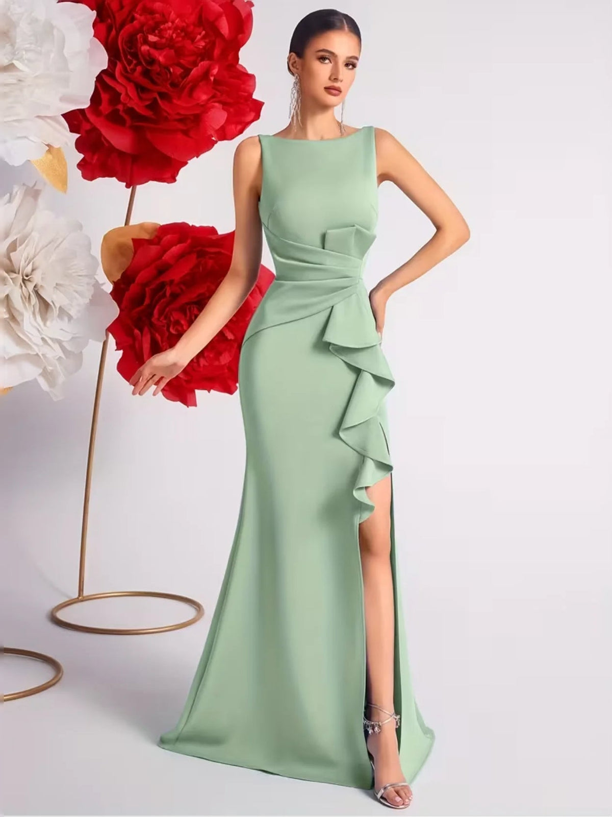 Floor-length mint green sleeveless prom dress with round neck, peplum ruffles, side slit