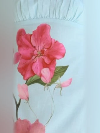 Light blue fabric with large pink flower print