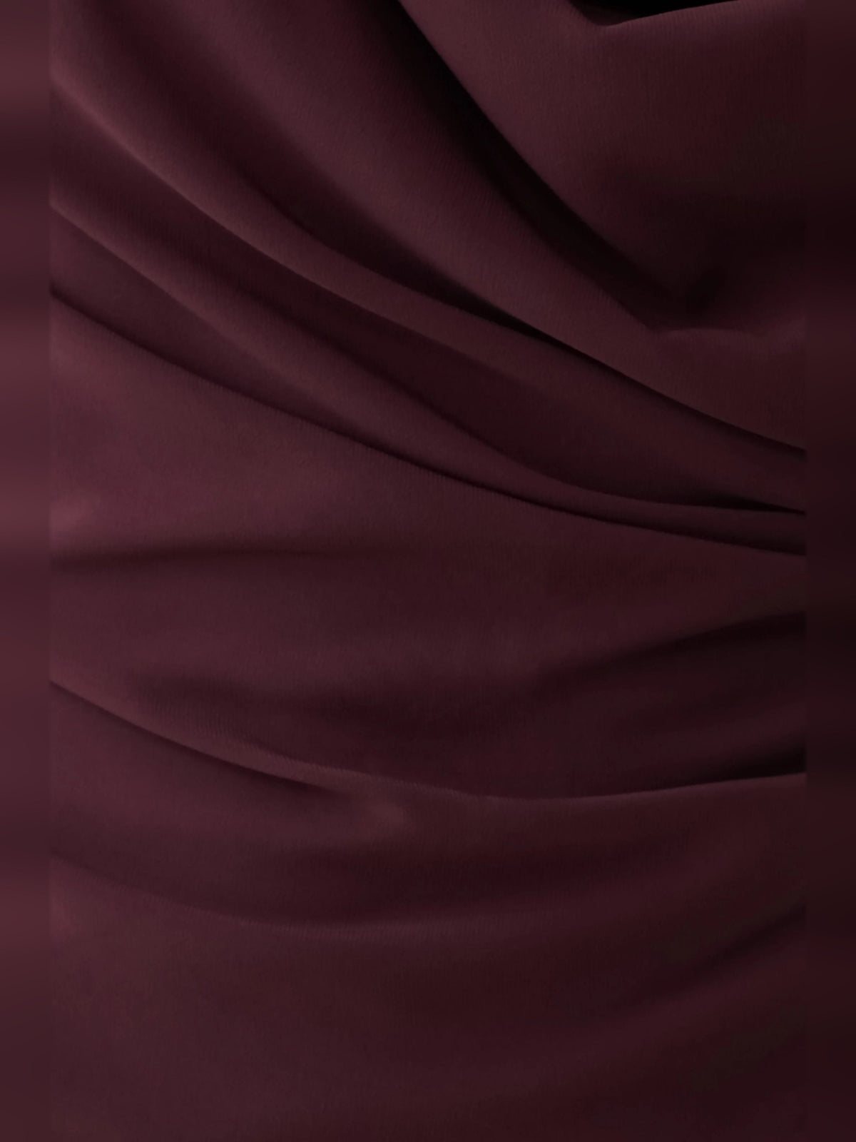 Plum satin fabric close-up with smooth sheen and draped folds