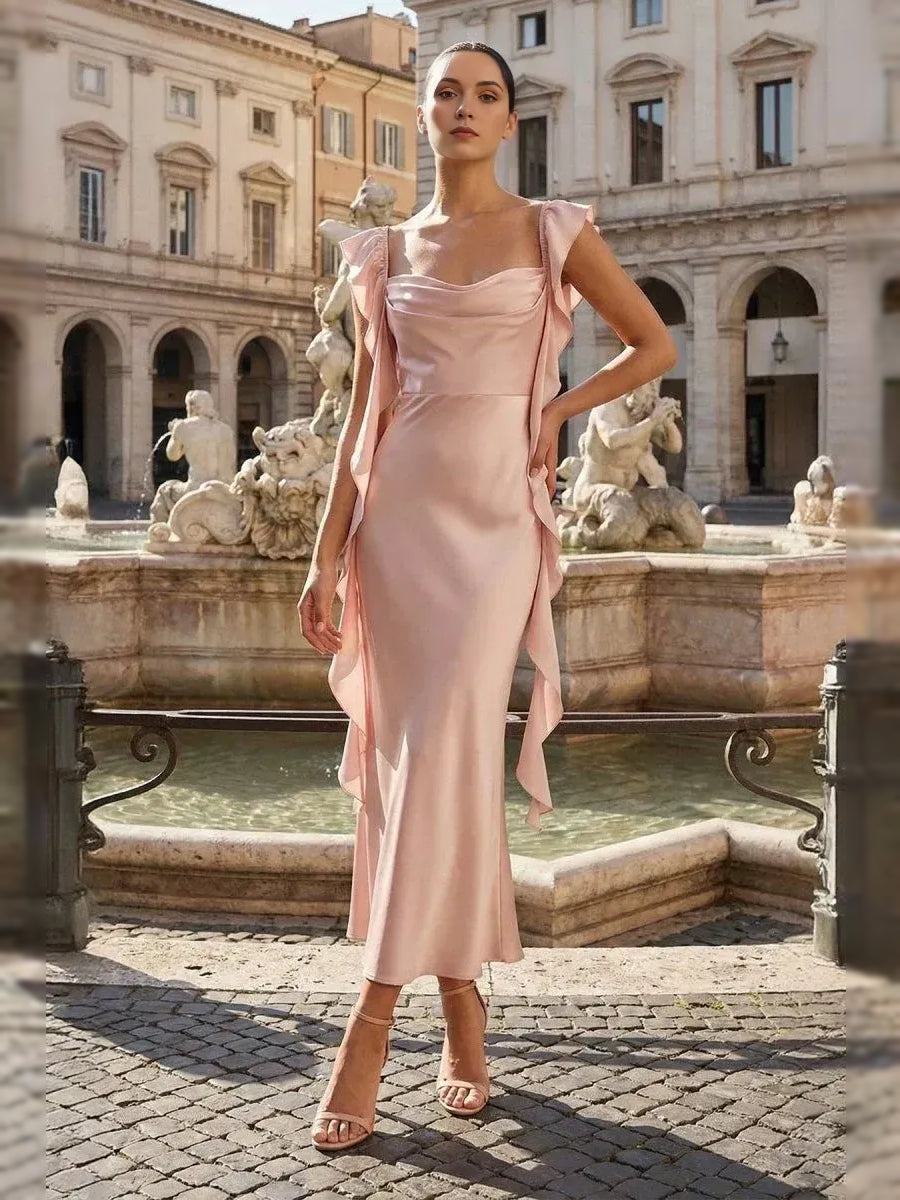 Blush pink satin prom dress with cowl neckline, ruffled shoulder details, column midi length