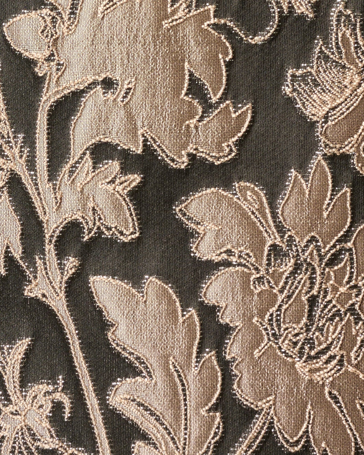 Taupe floral embroidery detail on dark black fabric, textured woven look