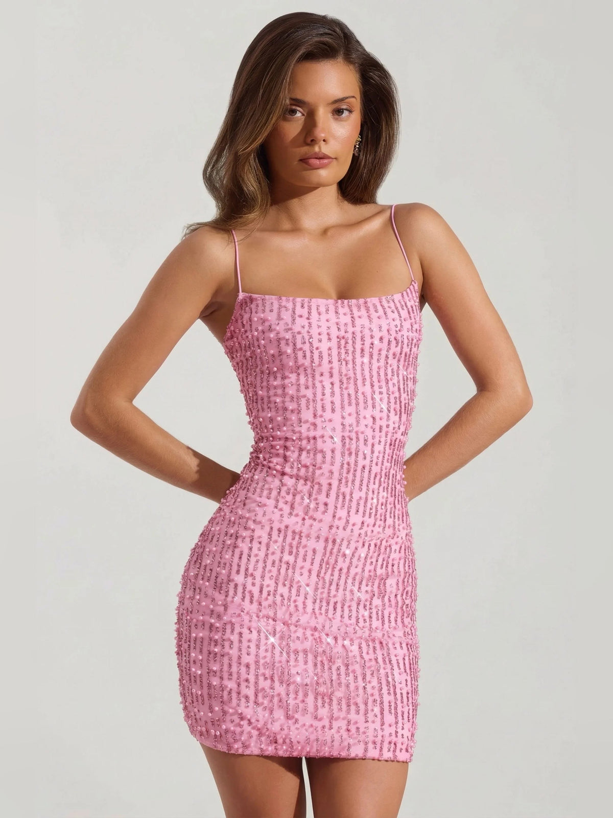 Pink scoop neck bodycon mini dress, front view, spaghetti straps and sequin texture
