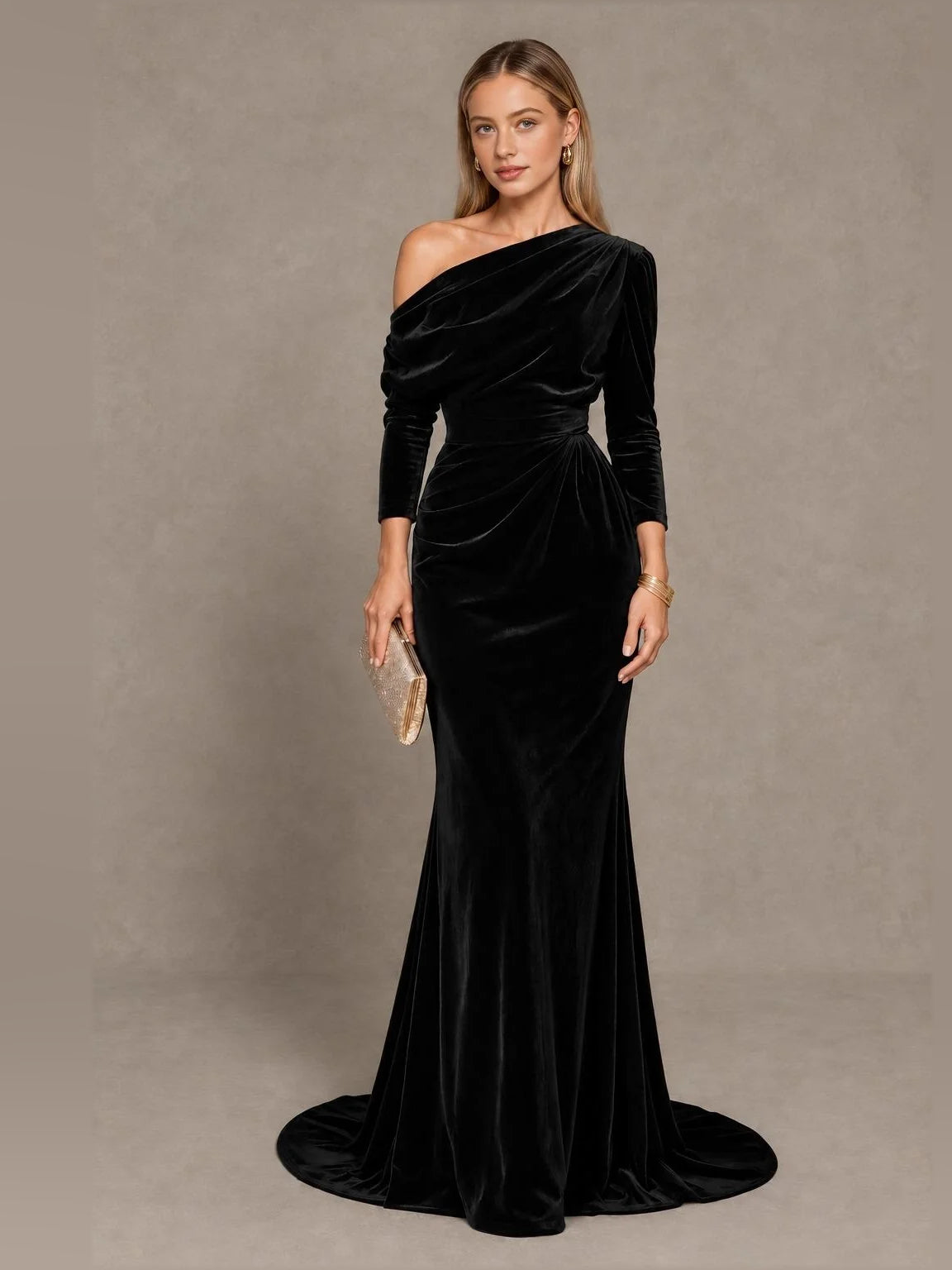 Black velvet one-shoulder mermaid gown with draped bodice and long sleeve