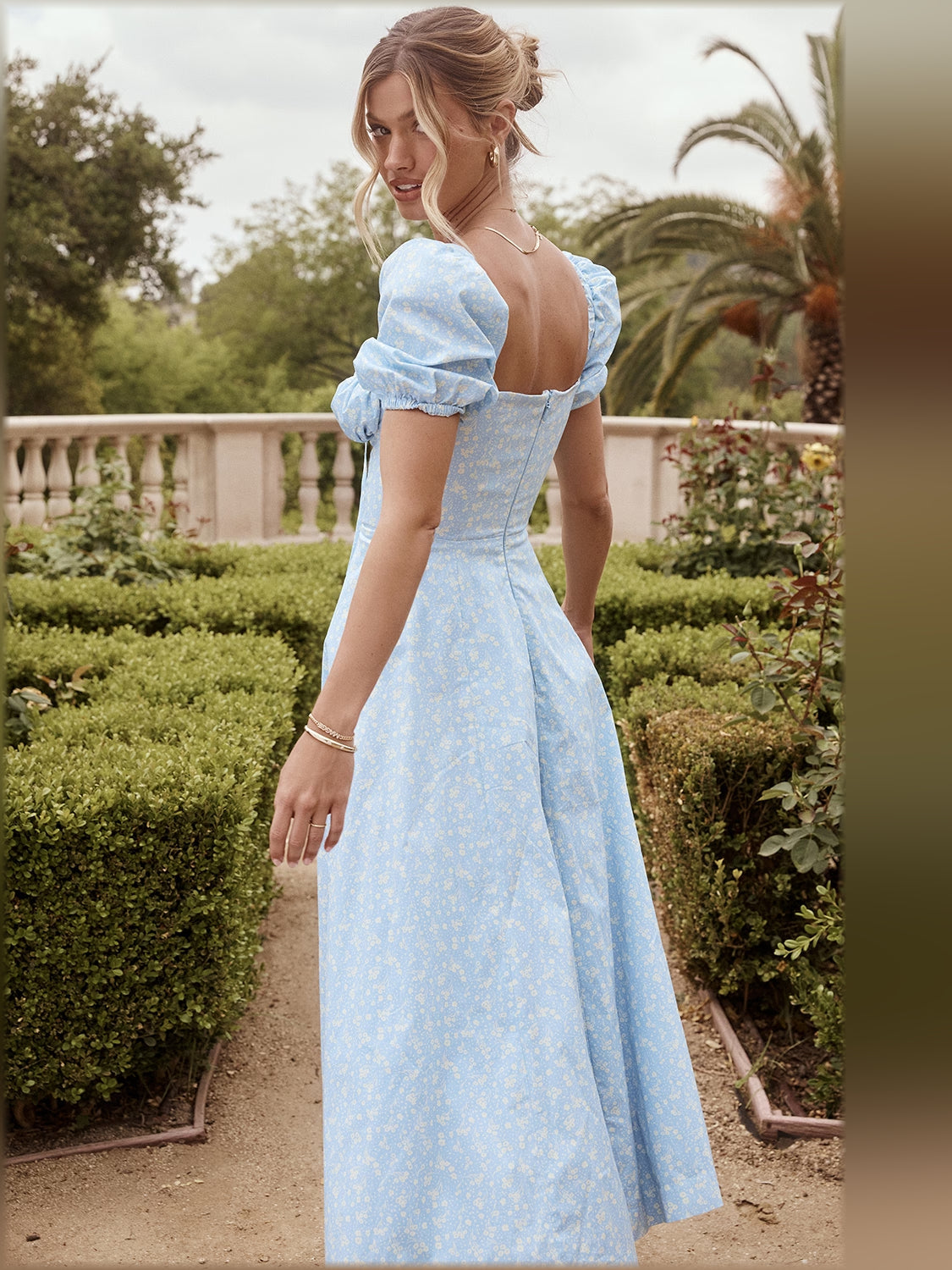 Light blue floral midi dress side view, puff sleeves, square neckline, gathered waist