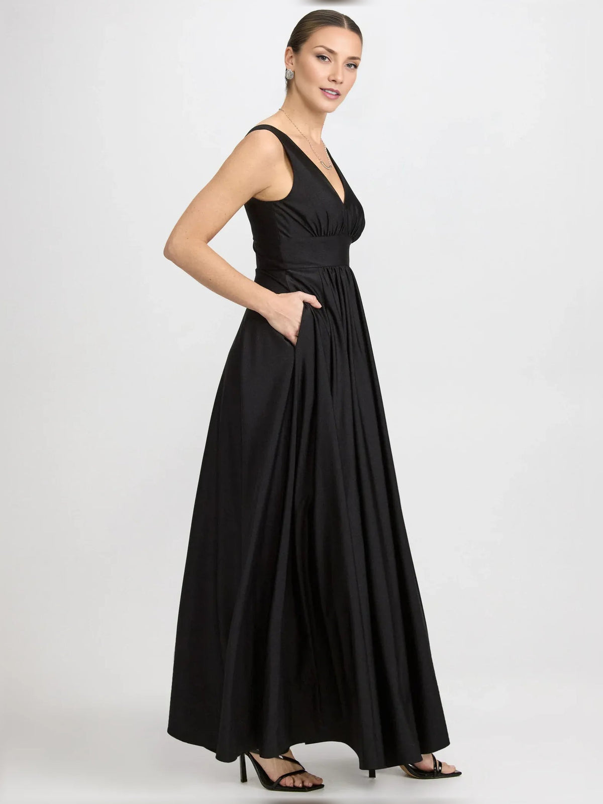 Black V-neck ruched floor-length formal dress with side slit, sleeveless and gathered waist