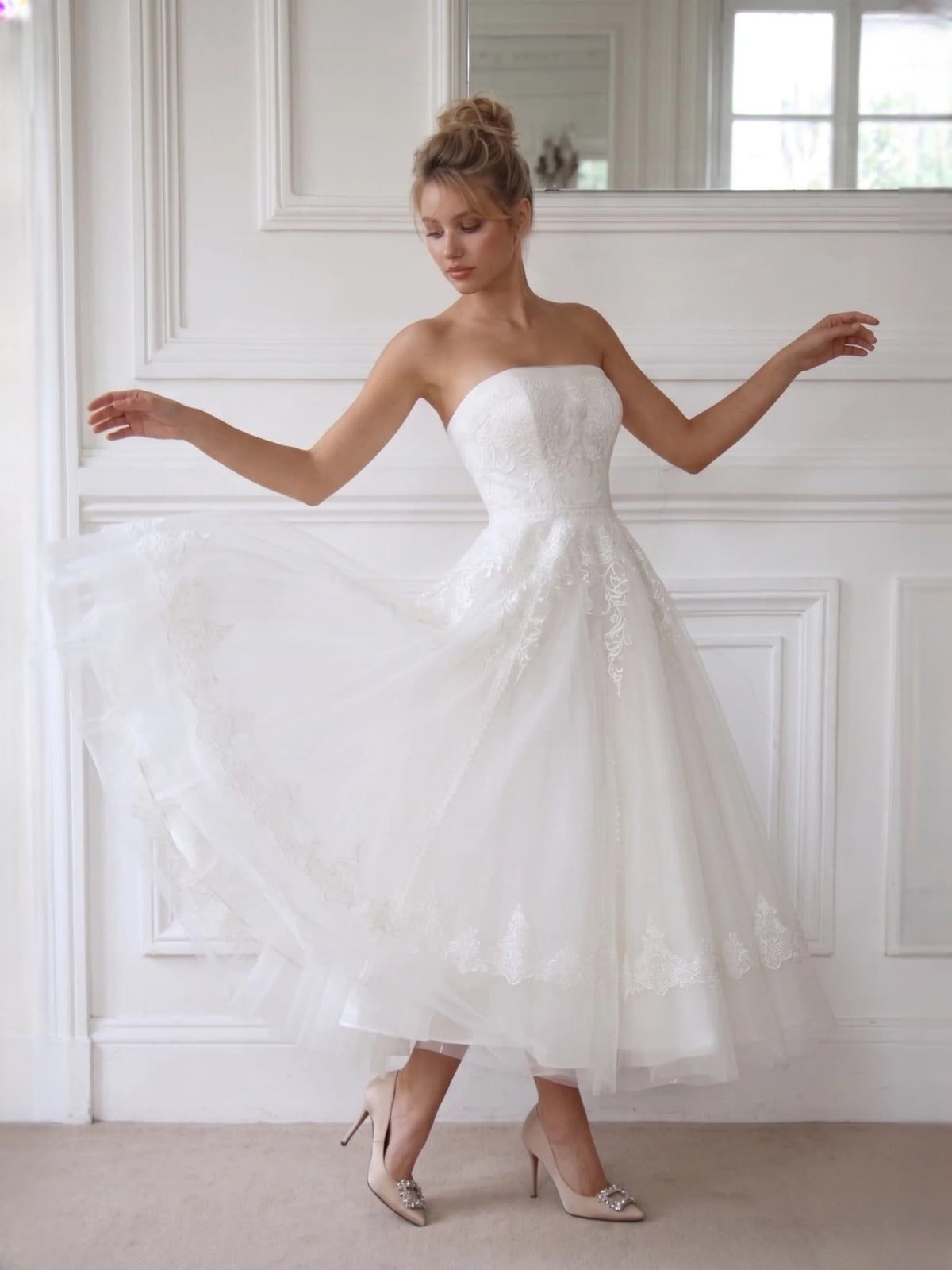 Ivory strapless A-line short wedding dress with lace overlay and flowing tulle skirt