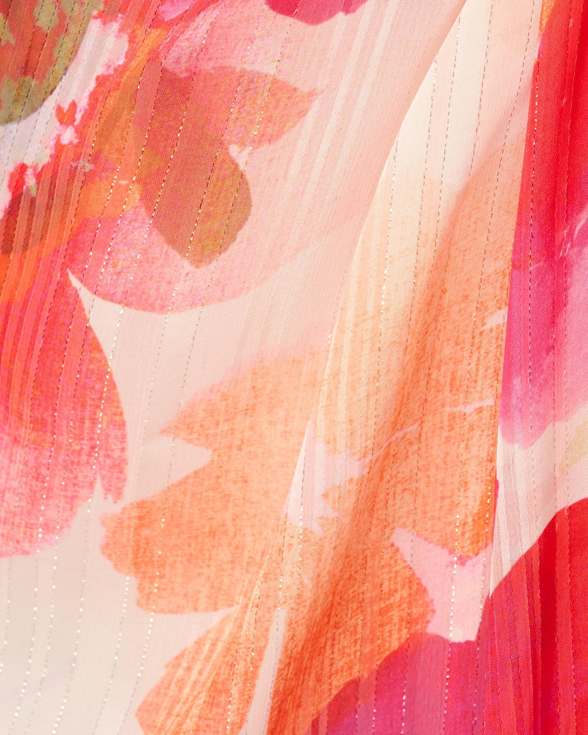 Textured floral fabric close-up in ivory with pink/red blooms