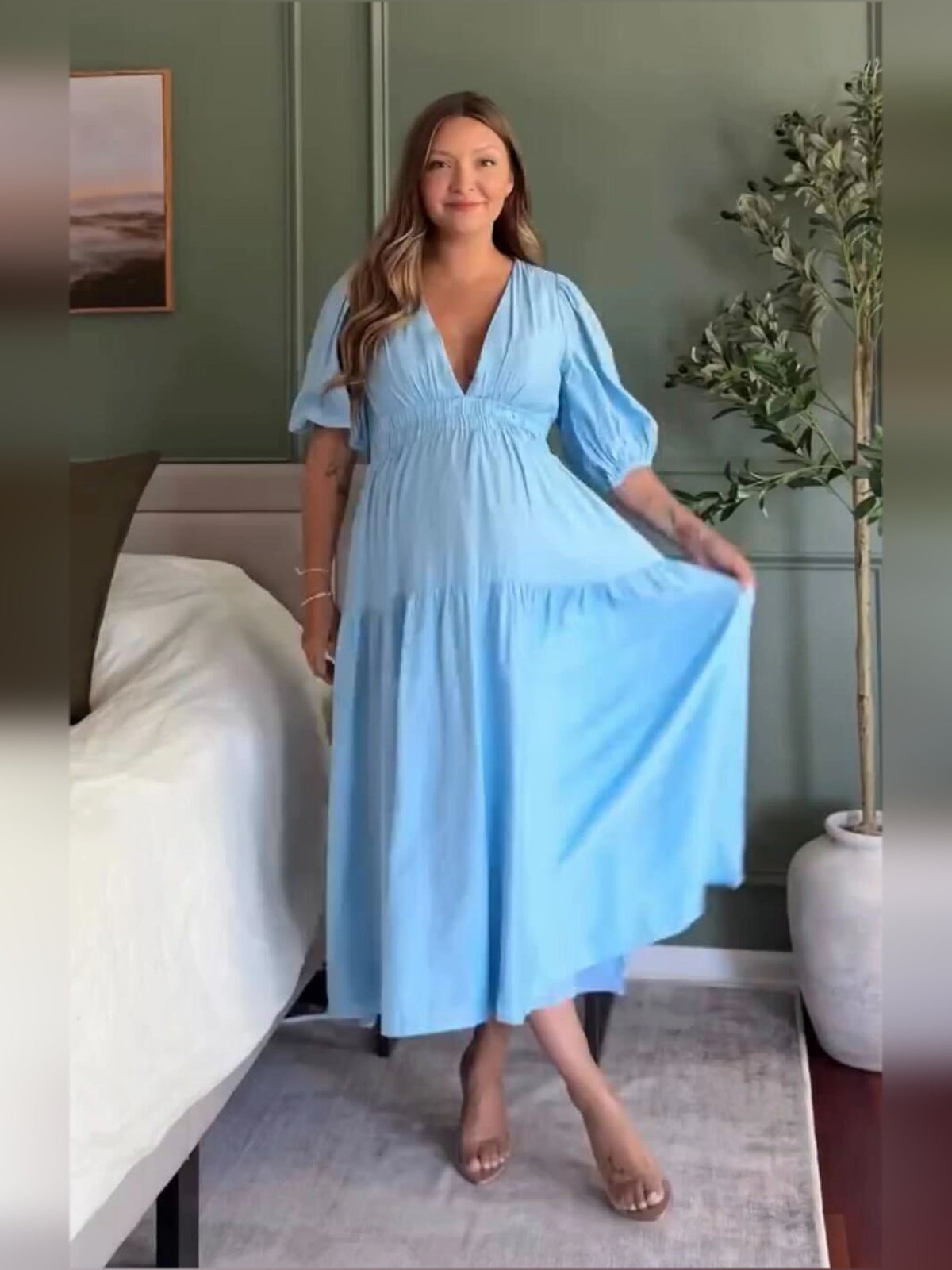 Blue midi formal dress with V-neck and tiered skirt, relaxed front pose