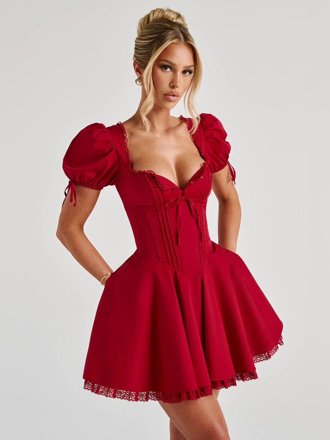 Red mini dress with square neckline, puff sleeves with tie cuffs, flared skirt