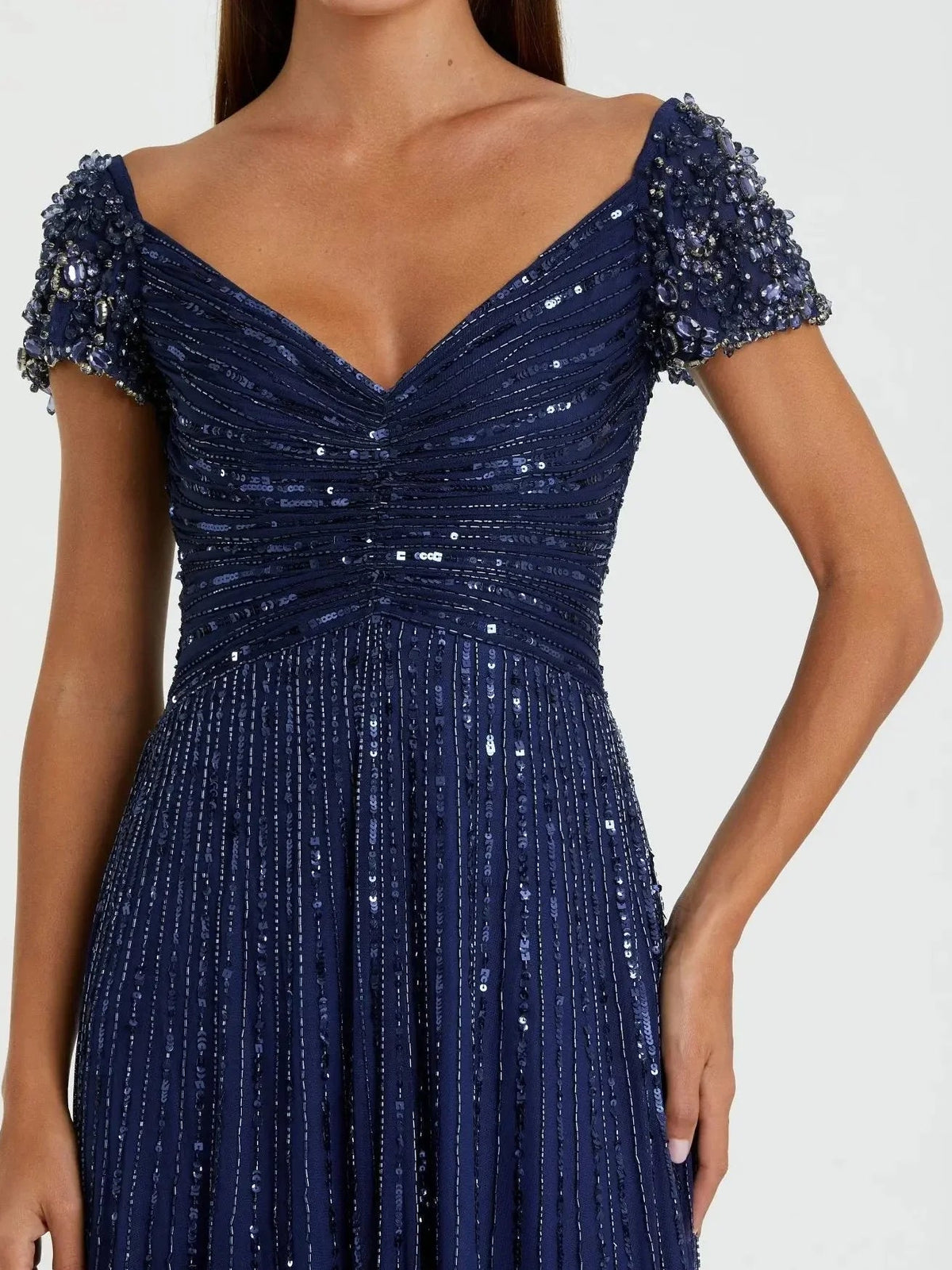 Navy blue beaded formal dress with sweetheart neckline and textured cap sleeves