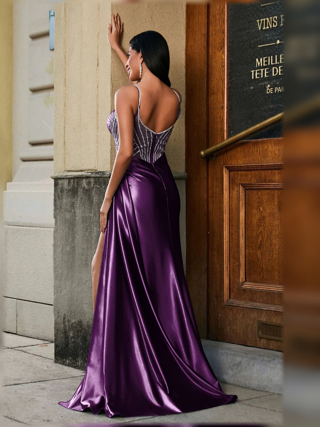 Deep purple sweetheart formal dress with beaded bodice, high slit, and flowing satin skirt