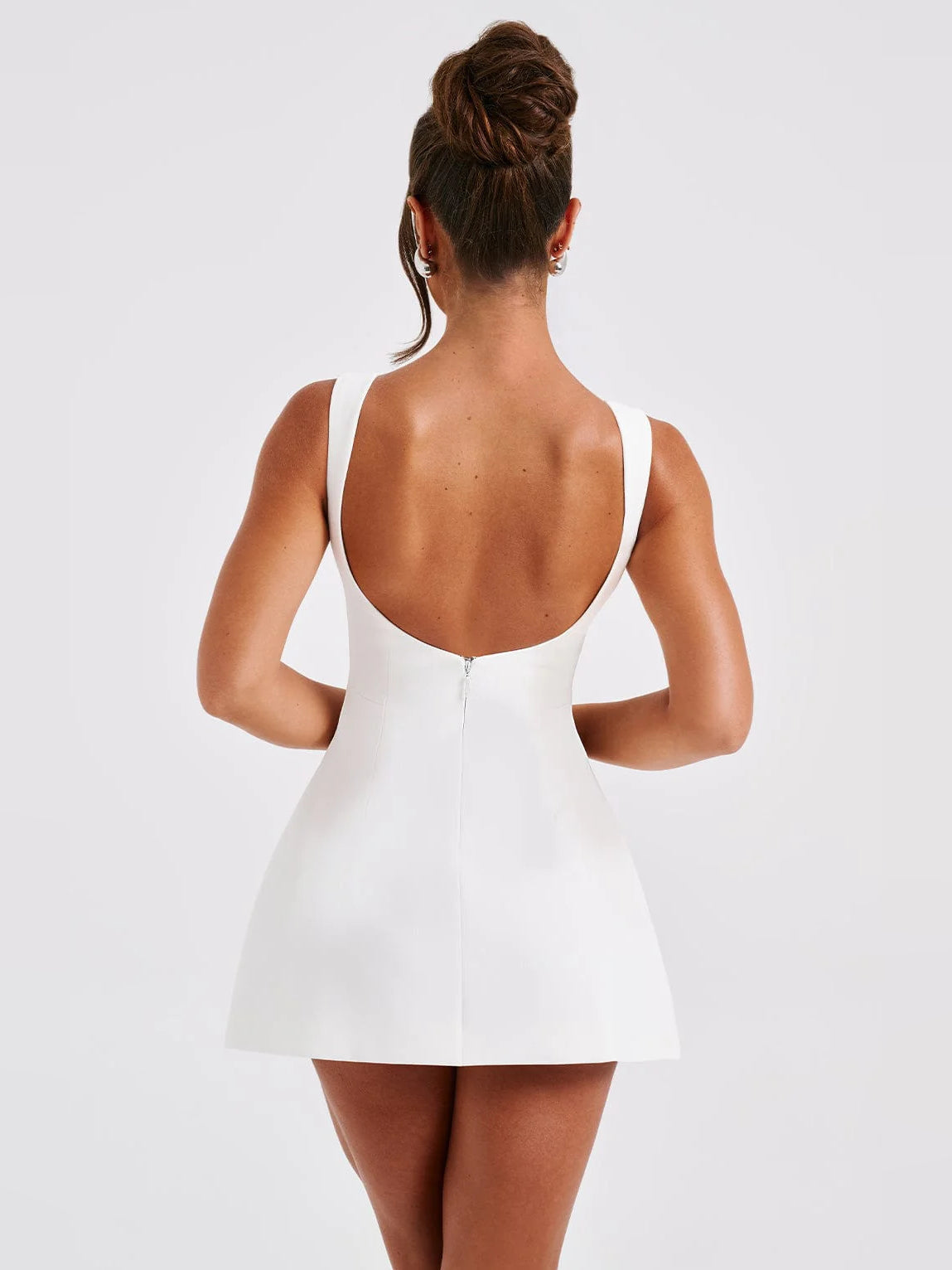 Ivory mini sleeveless dress with low open-back scoop and A-line skirt