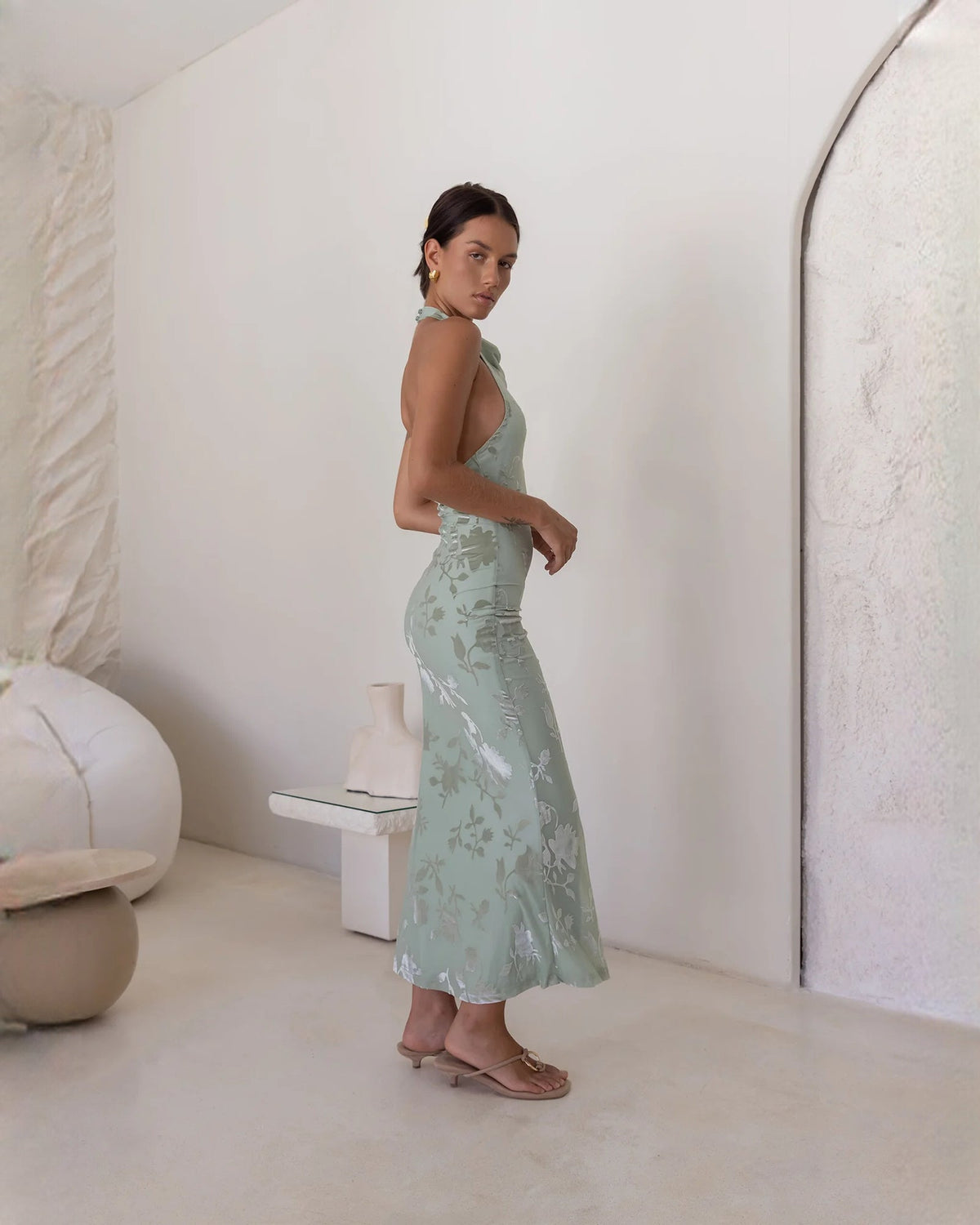 Dusty sage floral sleeveless halter A-line maxi dress in side profile