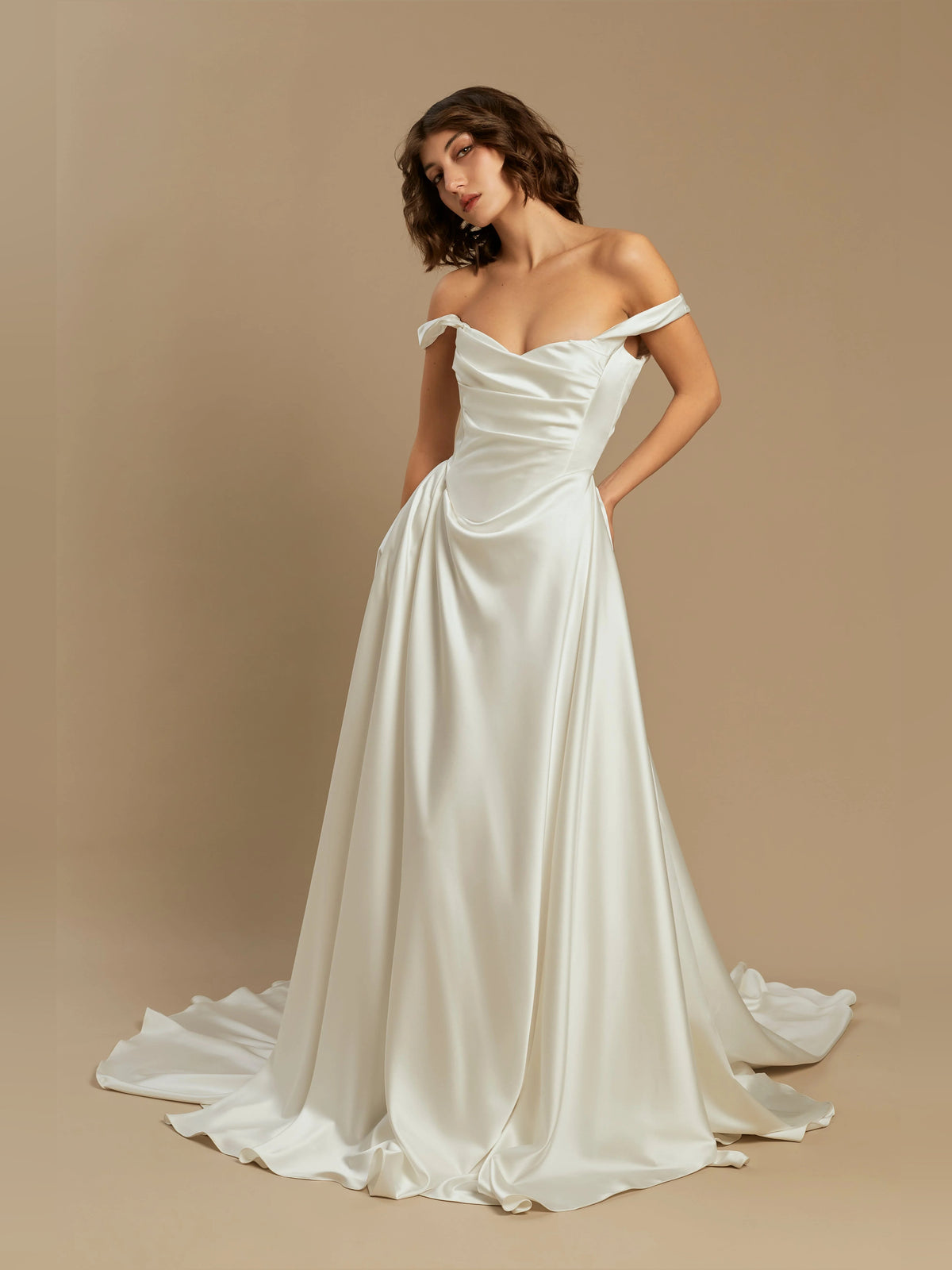 Ivory satin floor-length A-line wedding dress with draped corset and off-shoulder cowl neck