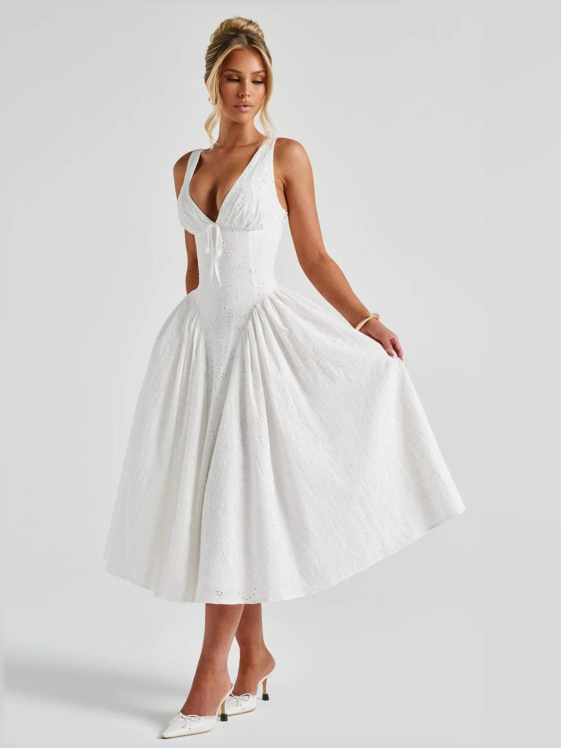 Ivory midi formal dress with sleeveless V-neck and full pleated skirt