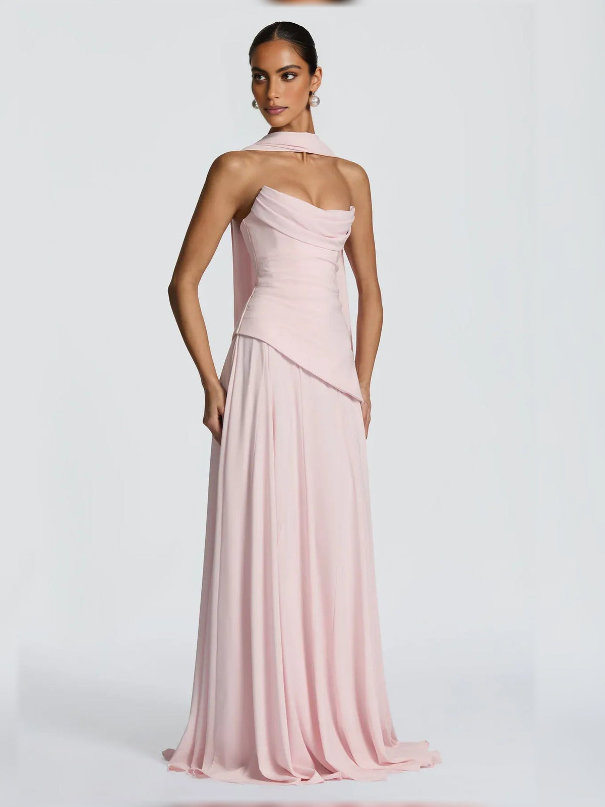 Blush pink strapless corset formal dress with draped bodice and floor-length skirt