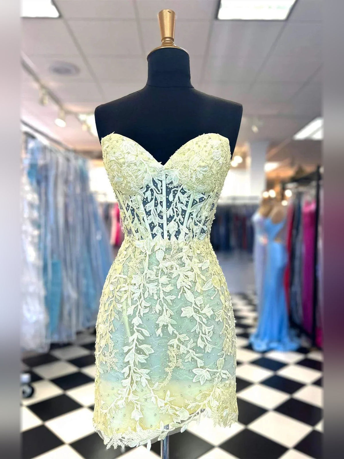 Pale lemon sweetheart corset mini dress with floral lace applique and lace-up back