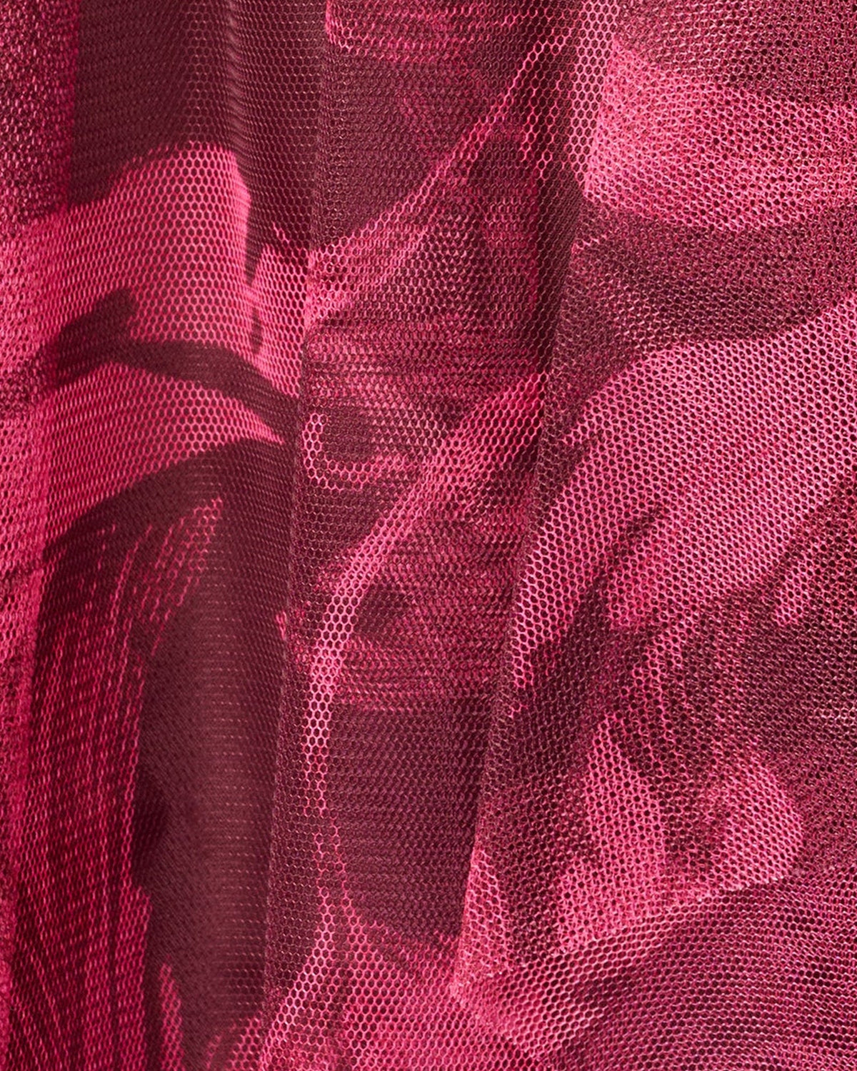 Burgundy floral mesh fabric with layered, textured pattern