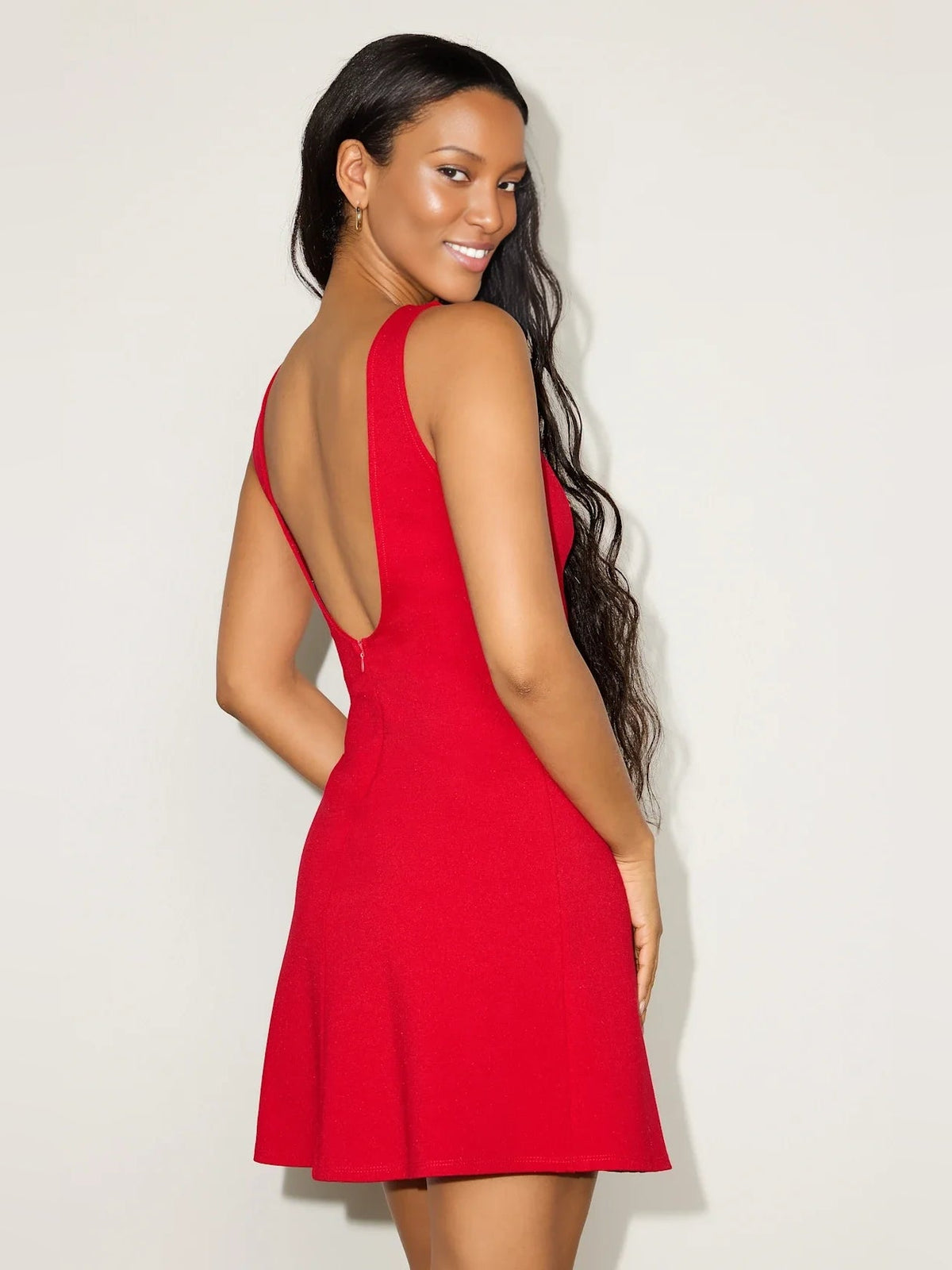 Red sleeveless A-line mini dress with open back and boat-neck front