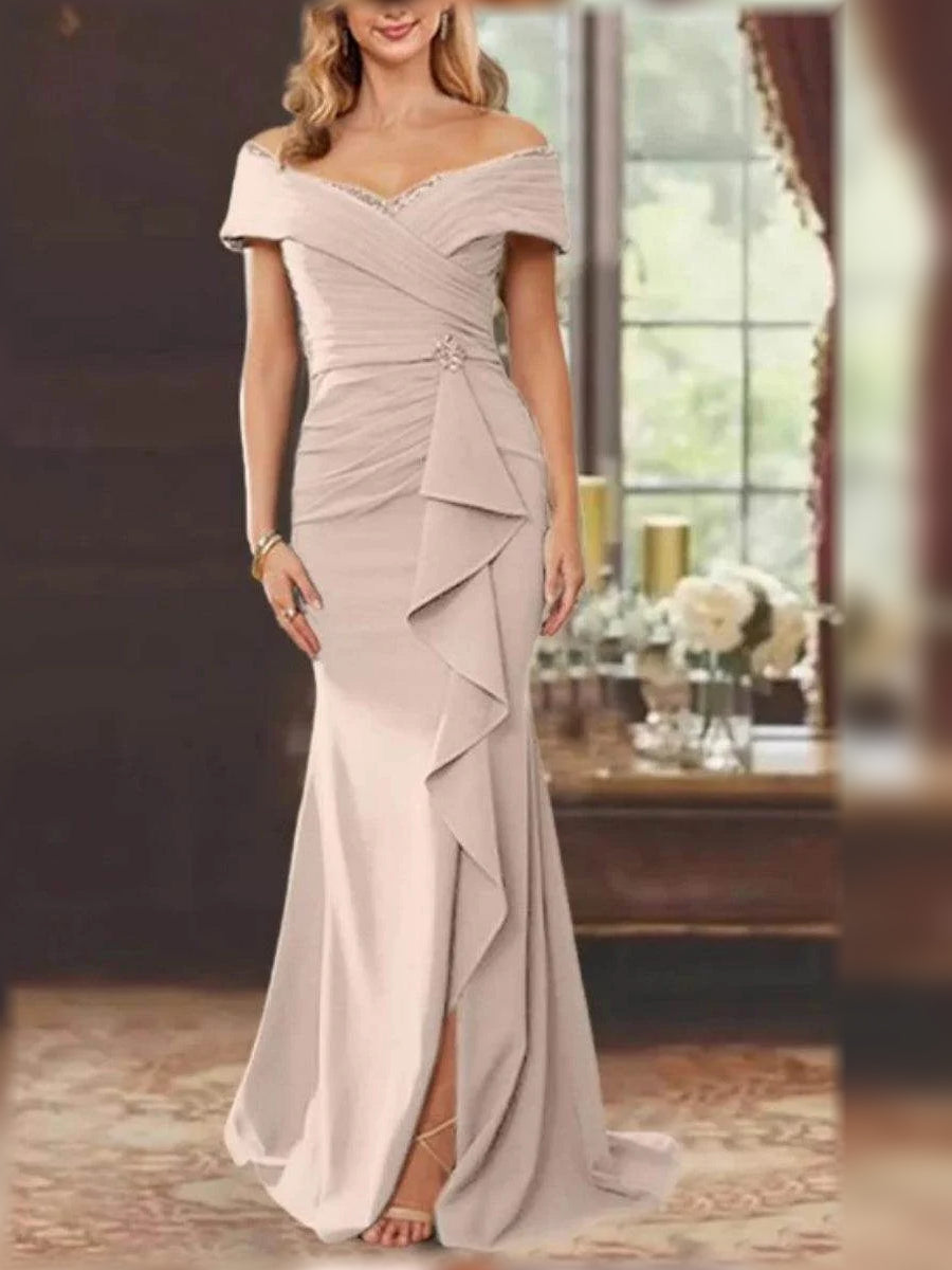 Champagne off-shoulder floor-length mermaid gown with ruched bodice and tiered draped panels.