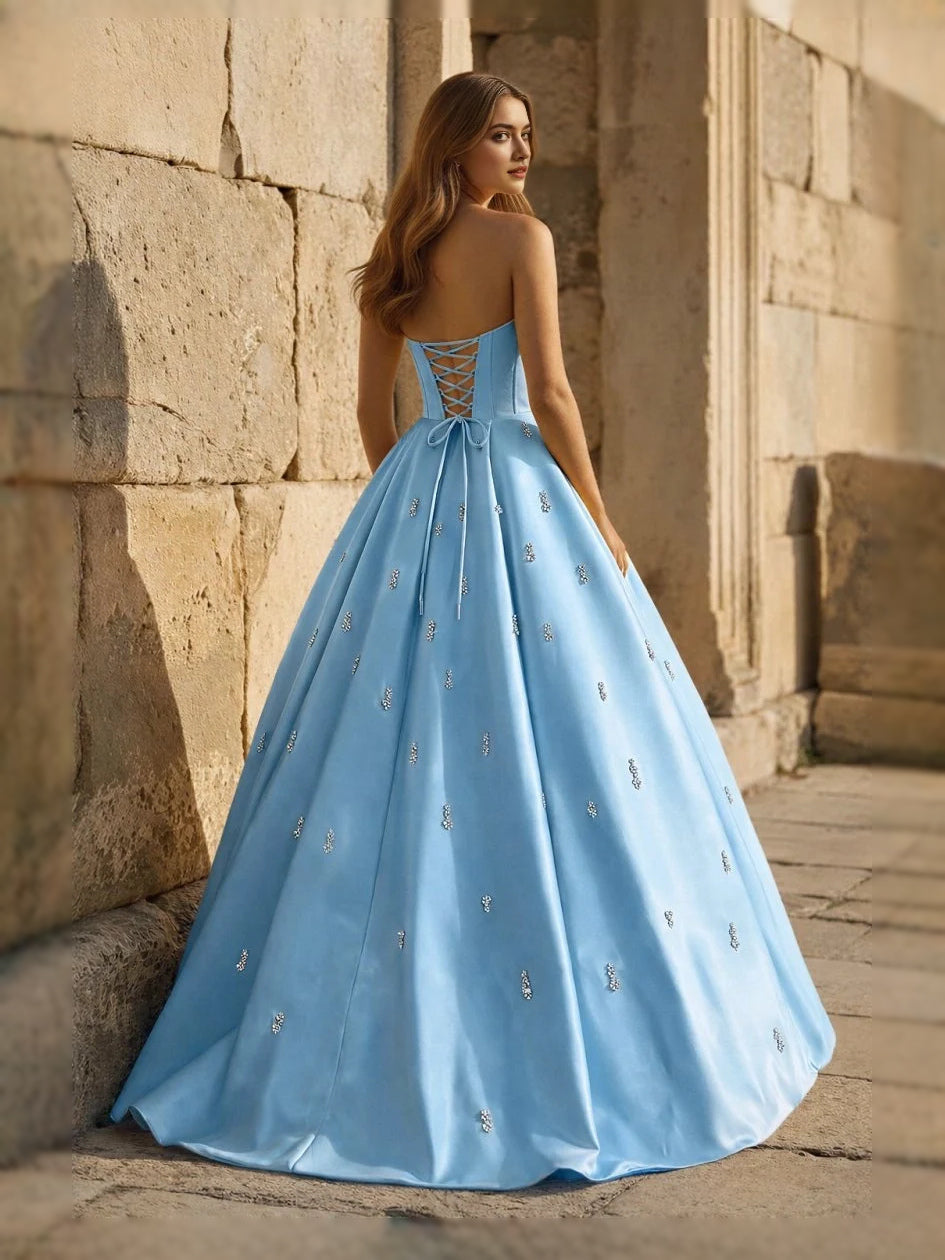Light blue sweetheart corset ball gown with thin straps and full floor-length skirt, front view