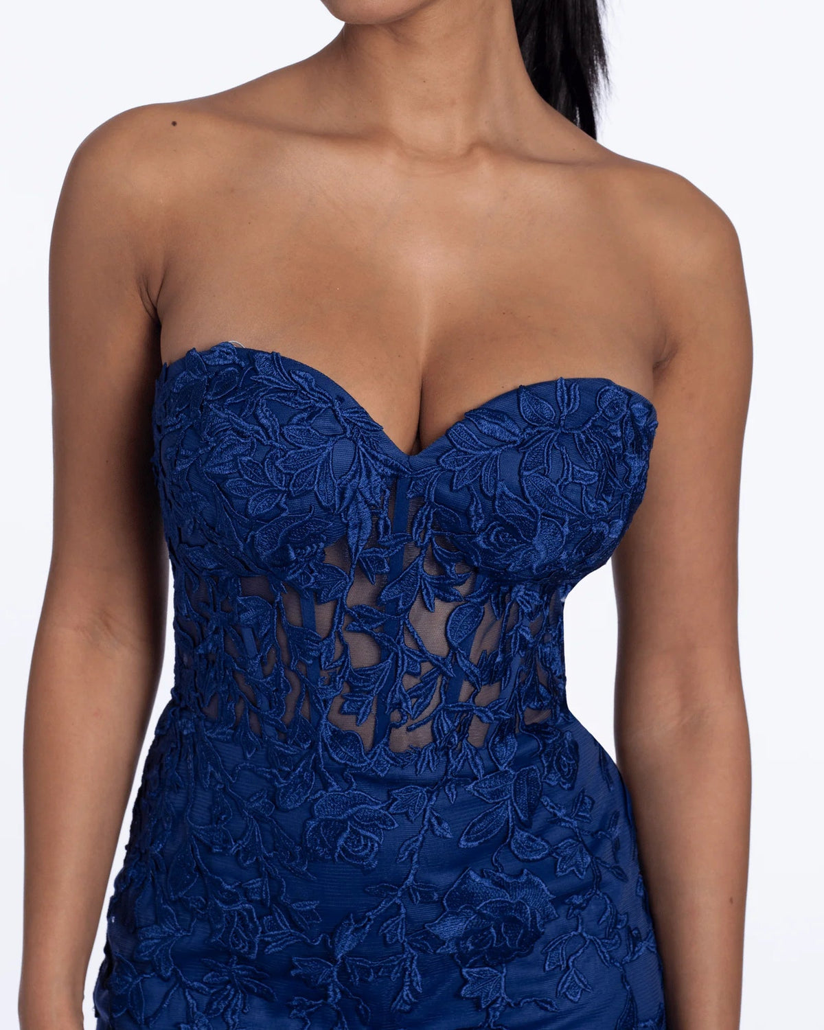 Navy strapless corset bodice with rose embroidery and lattice cutout detail.