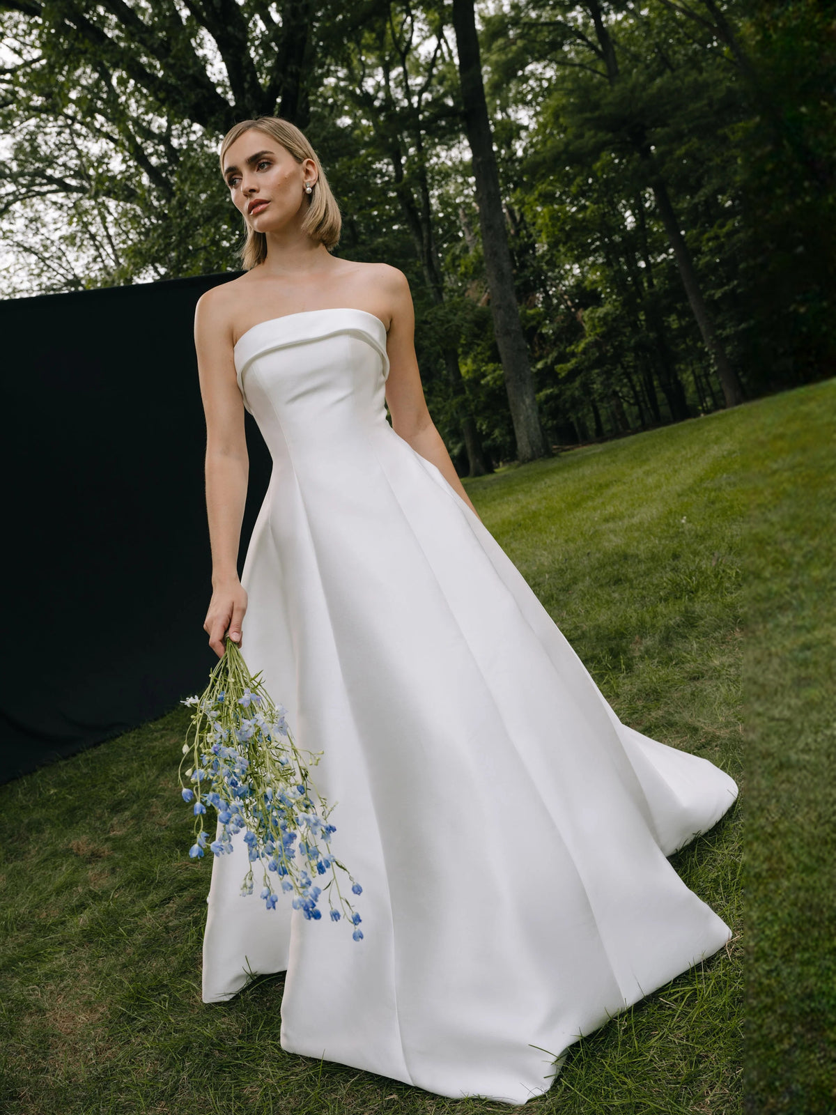 Ivory strapless A-line wedding dress with satin skirt, pearl trim accents