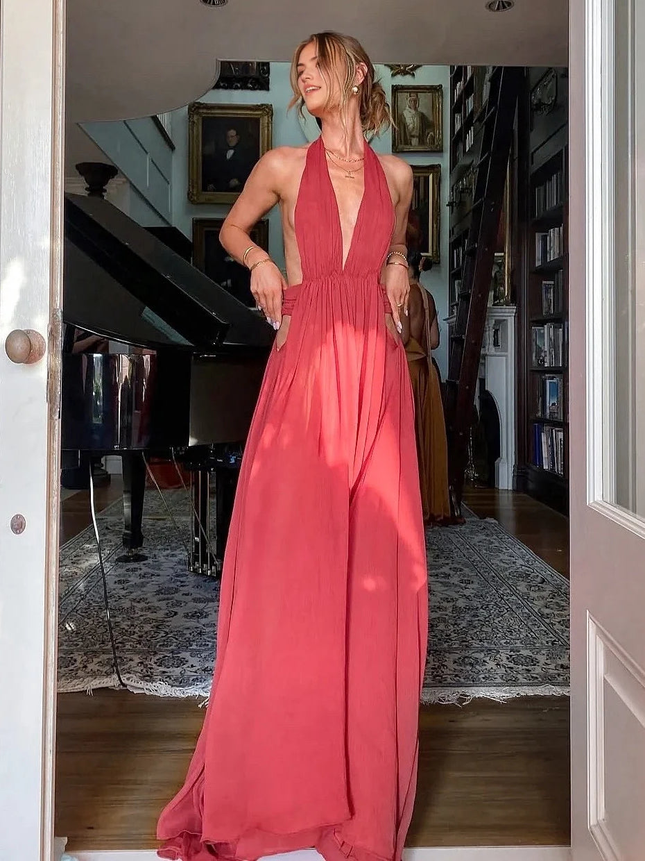 Red sleeveless V-neck maxi dress with gathered waist and pleated skirt