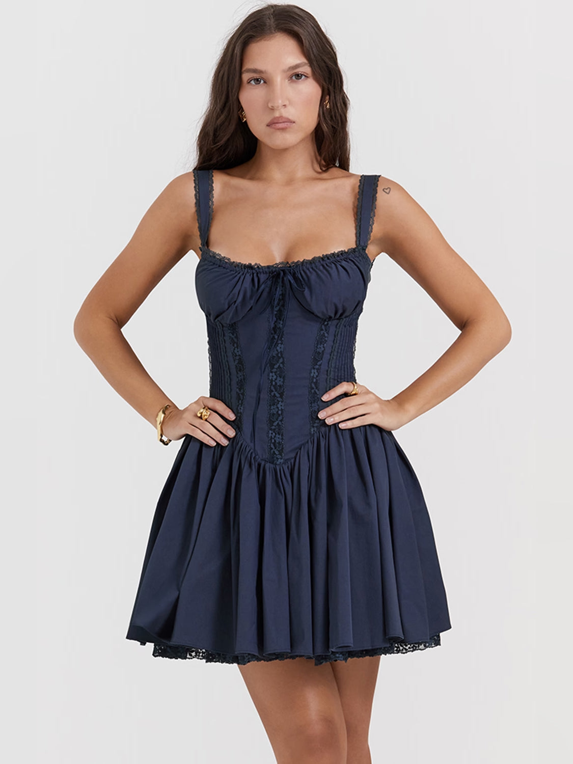Navy corset mini dress with smocked bodice detail and spaghetti straps, short tiered hem