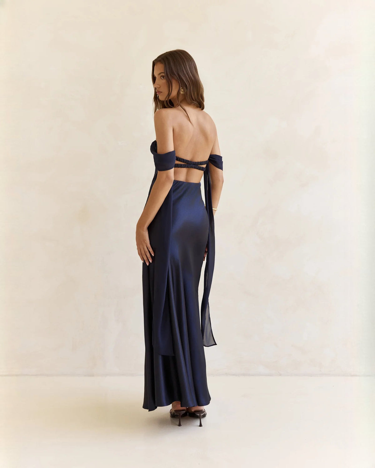 Navy satin off-shoulder A-line maxi dress with open back and ribbon tie straps