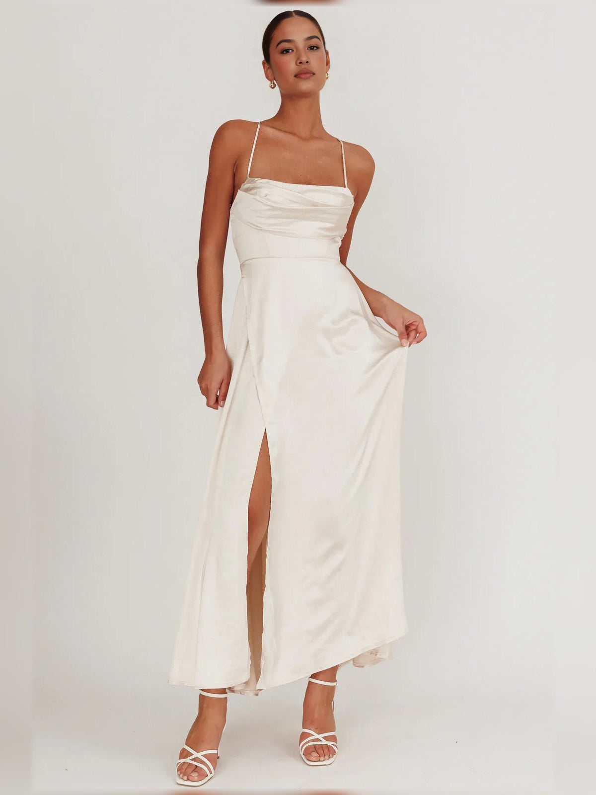 Cream cowl-neck sleeveless formal dress with spaghetti straps and front slit