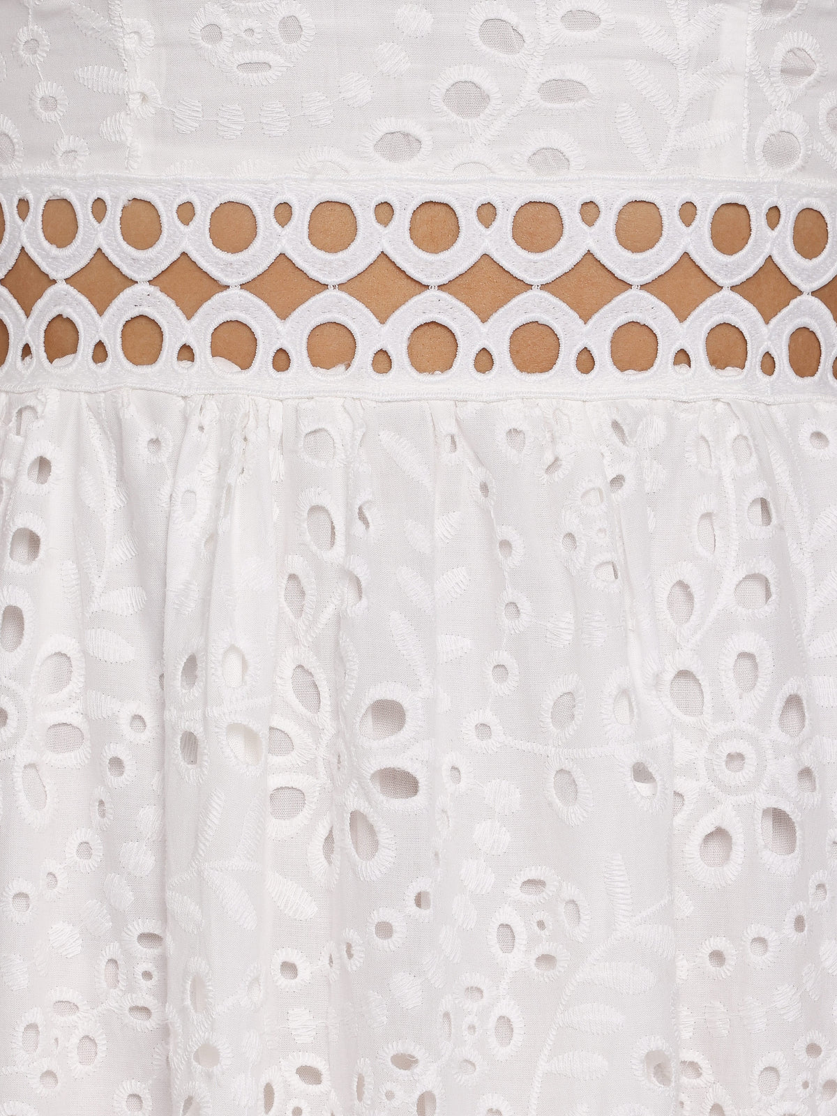 White lace and eyelet trim with scalloped border on the midi dress skirt