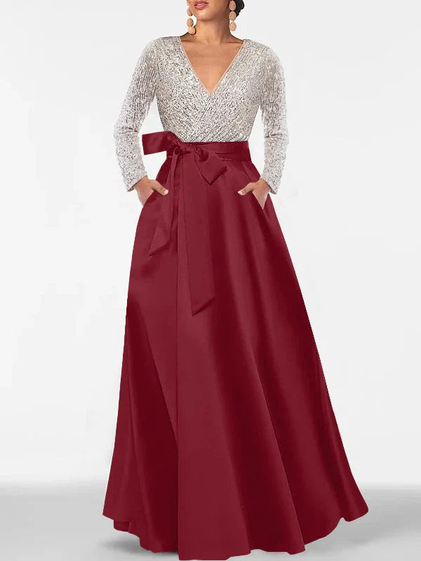 V-neck formal dress with silver sequin long sleeves and burgundy satin full skirt