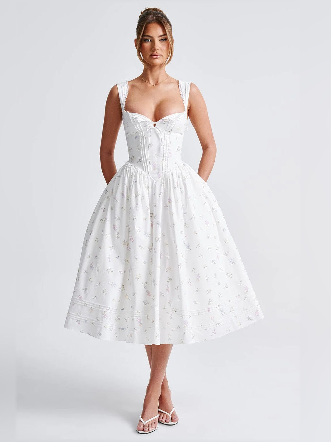 White midi formal dress with sweetheart neckline, corset seams, gathered skirt, allover print