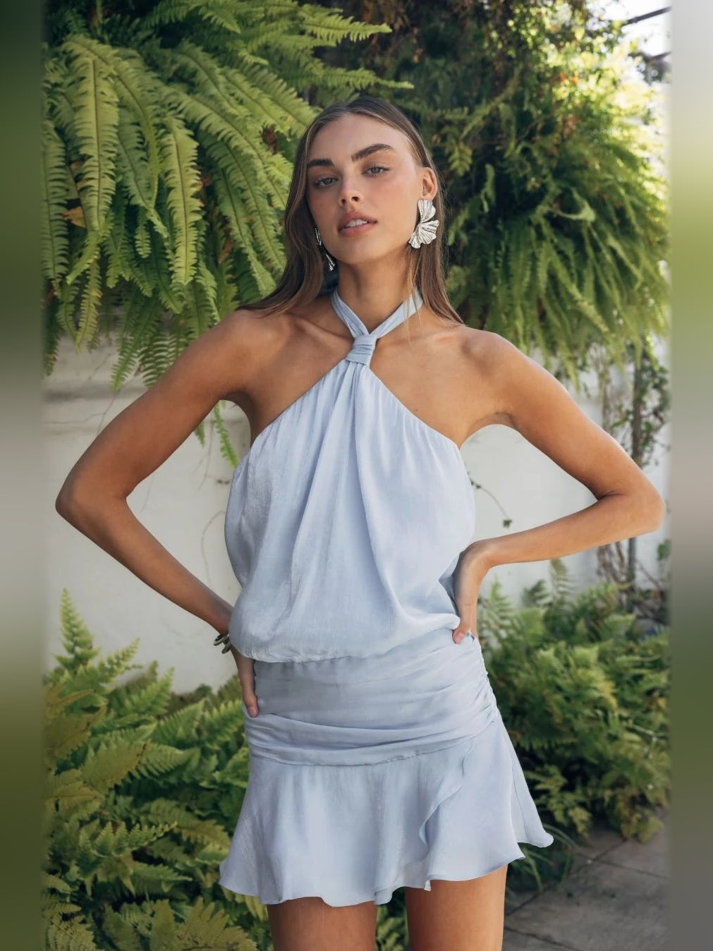 Light blue halter neck mini satin dress with sleeveless halter tie and gathered skirt