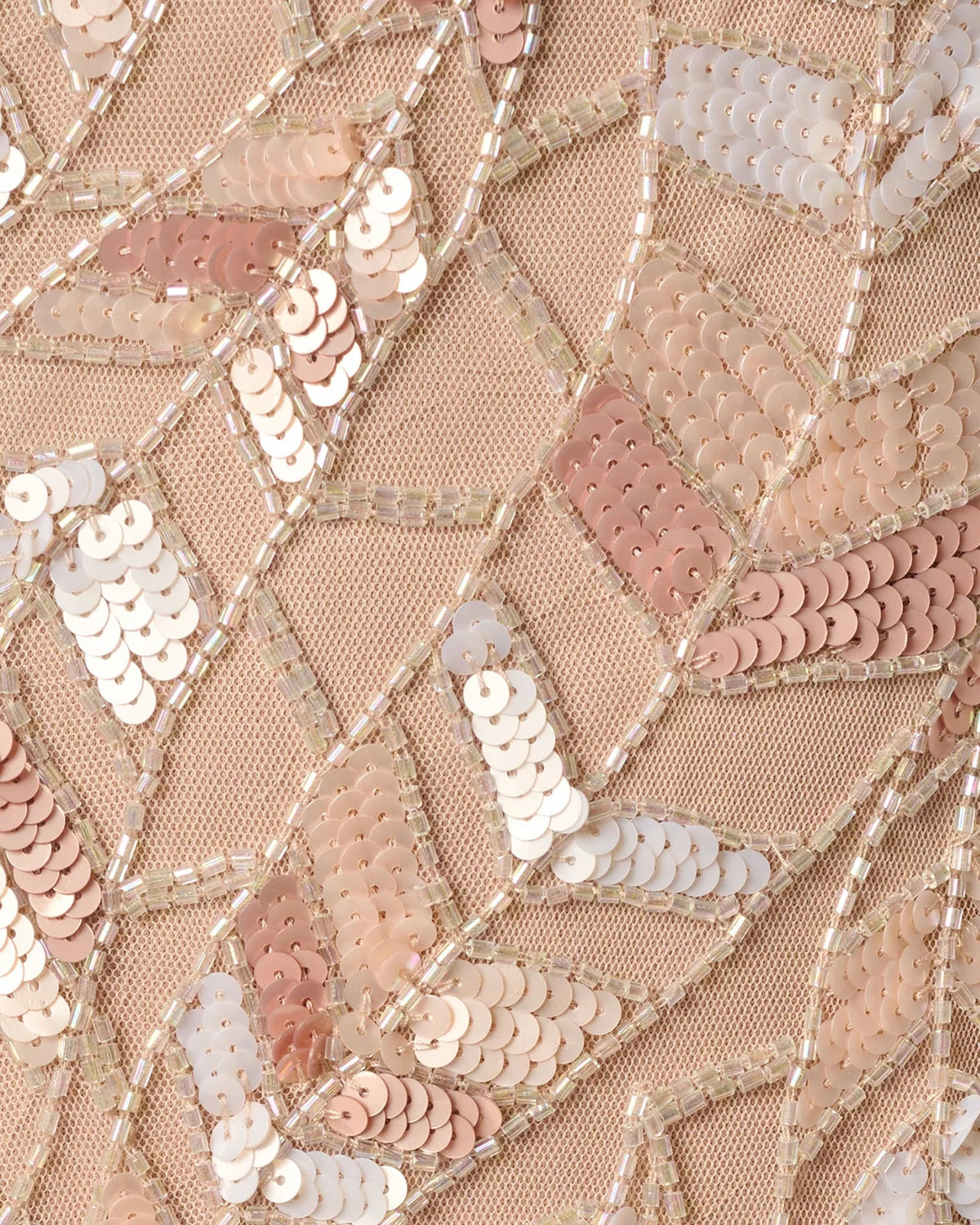 Close-up of rose taupe sequin embroidery with geometric grid pattern