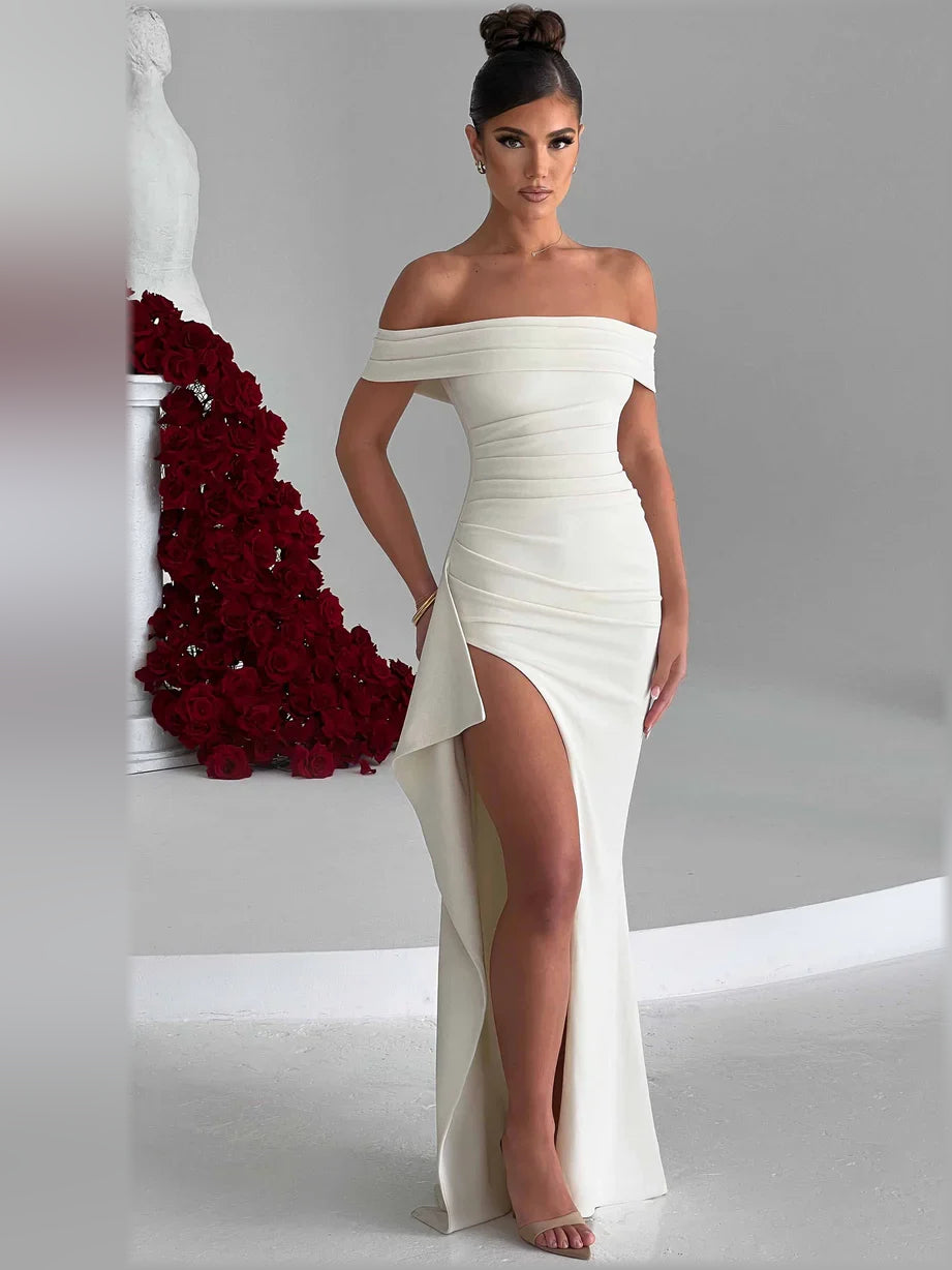 Ivory off-shoulder floor-length formal dress with ruched bodice and side slit.