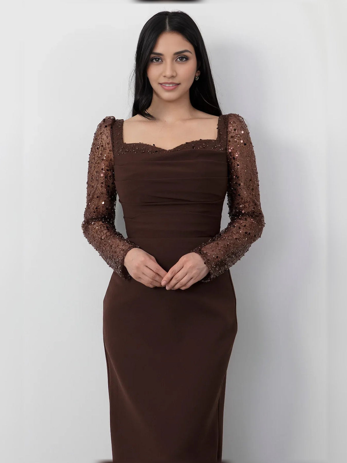 Espresso-brown square-neck formal dress with ruching and sheer long sleeves, floor-length