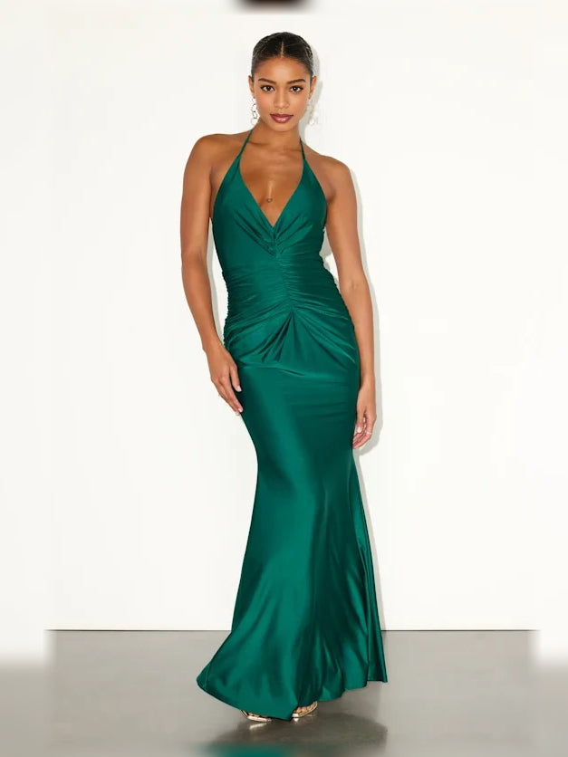 Emerald green halter neck formal dress with ruched drape and floor-length fitted skirt