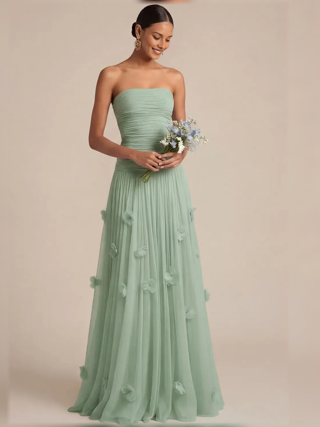 Dusty sage strapless floor-length dress with ruched waist and floral appliques