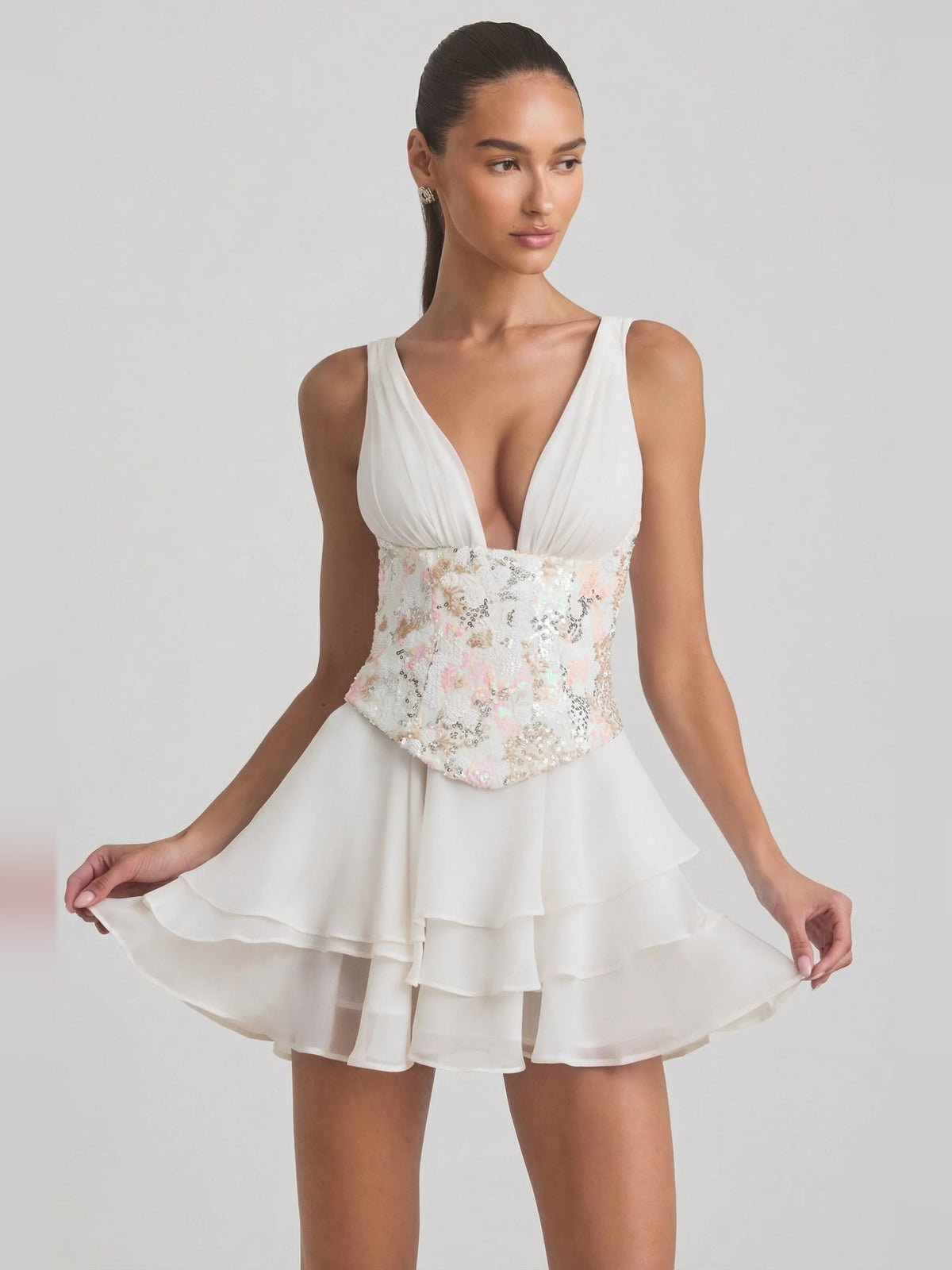 Ivory corset mini dress with deep V front, floral bodice, and layered ruffle skirt