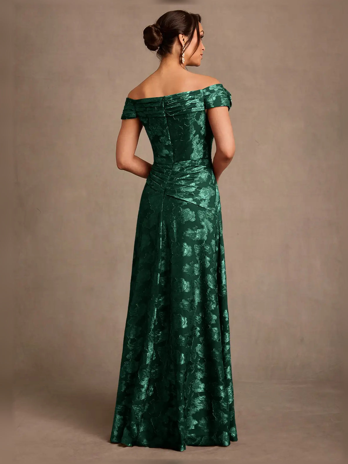 Emerald green off-shoulder maxi dress with ruched back panel and floral jacquard texture