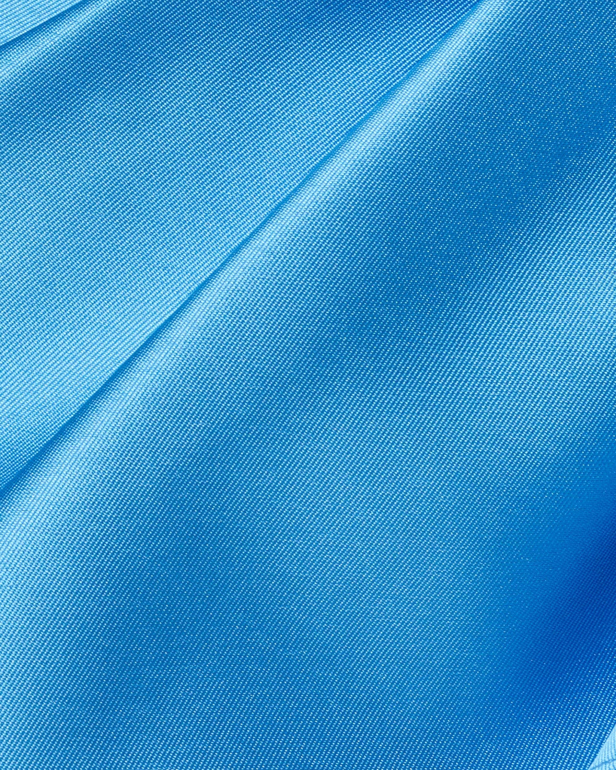 Sky blue satin-like fabric with subtle woven texture and diagonal seam