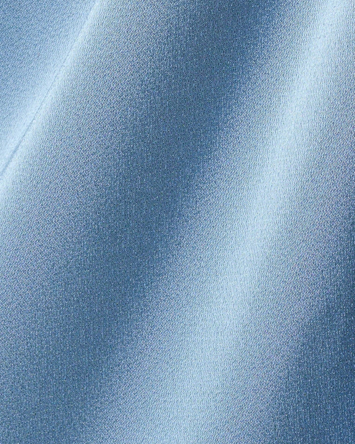 Light blue textured fabric close-up with subtle sparkle weave